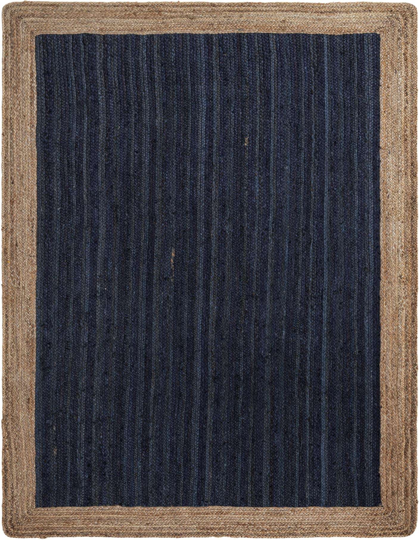 A 6x9 rectangular navy blue jute rug with a natural braided jute border, suitable for a living room.