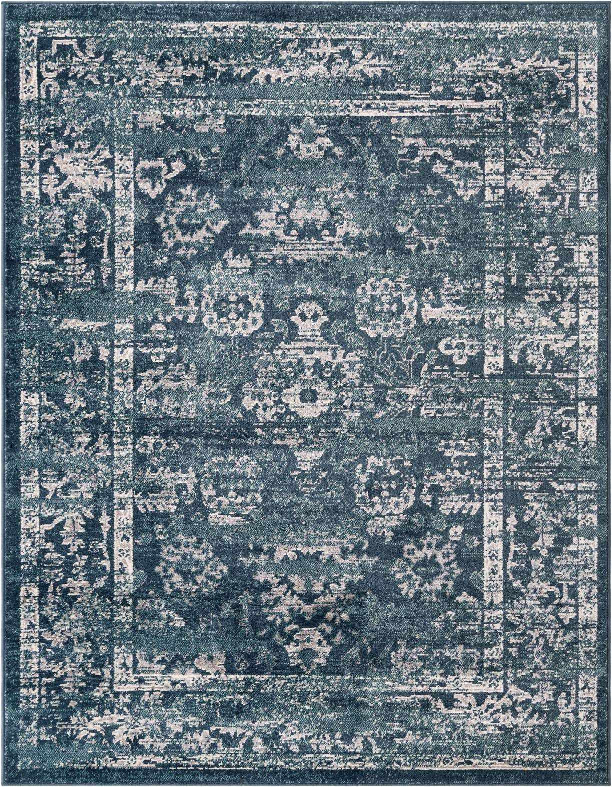 A 5x8 rectangular Charleston rug in varying shades of blue with a distressed traditional medallion and border pattern.