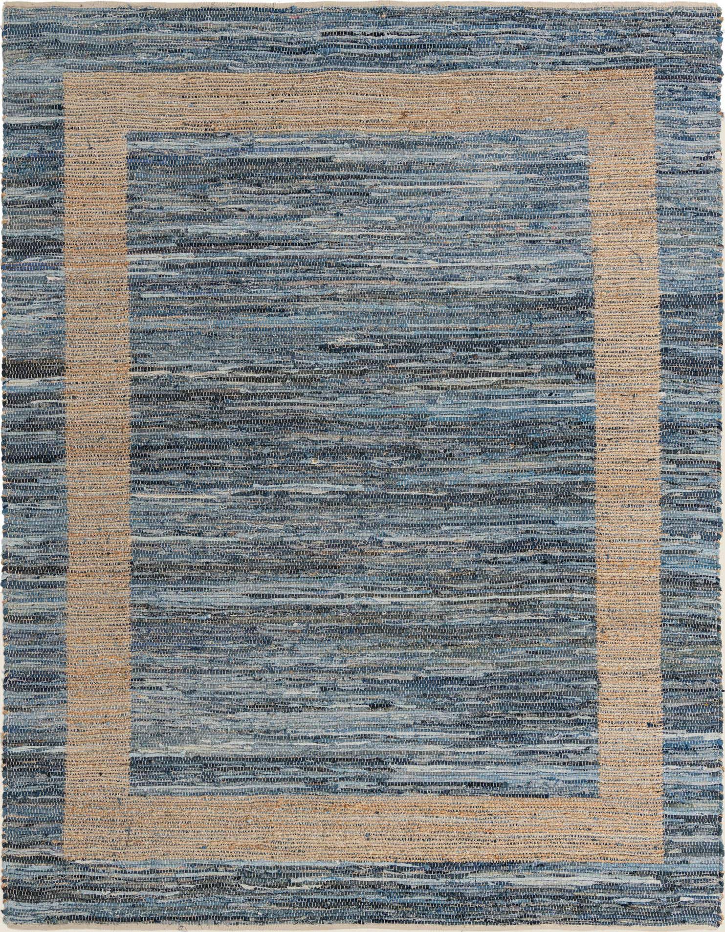 A 9x12 rectangular Chindi Jute rug featuring a textured flatweave of various blues with a natural jute border.