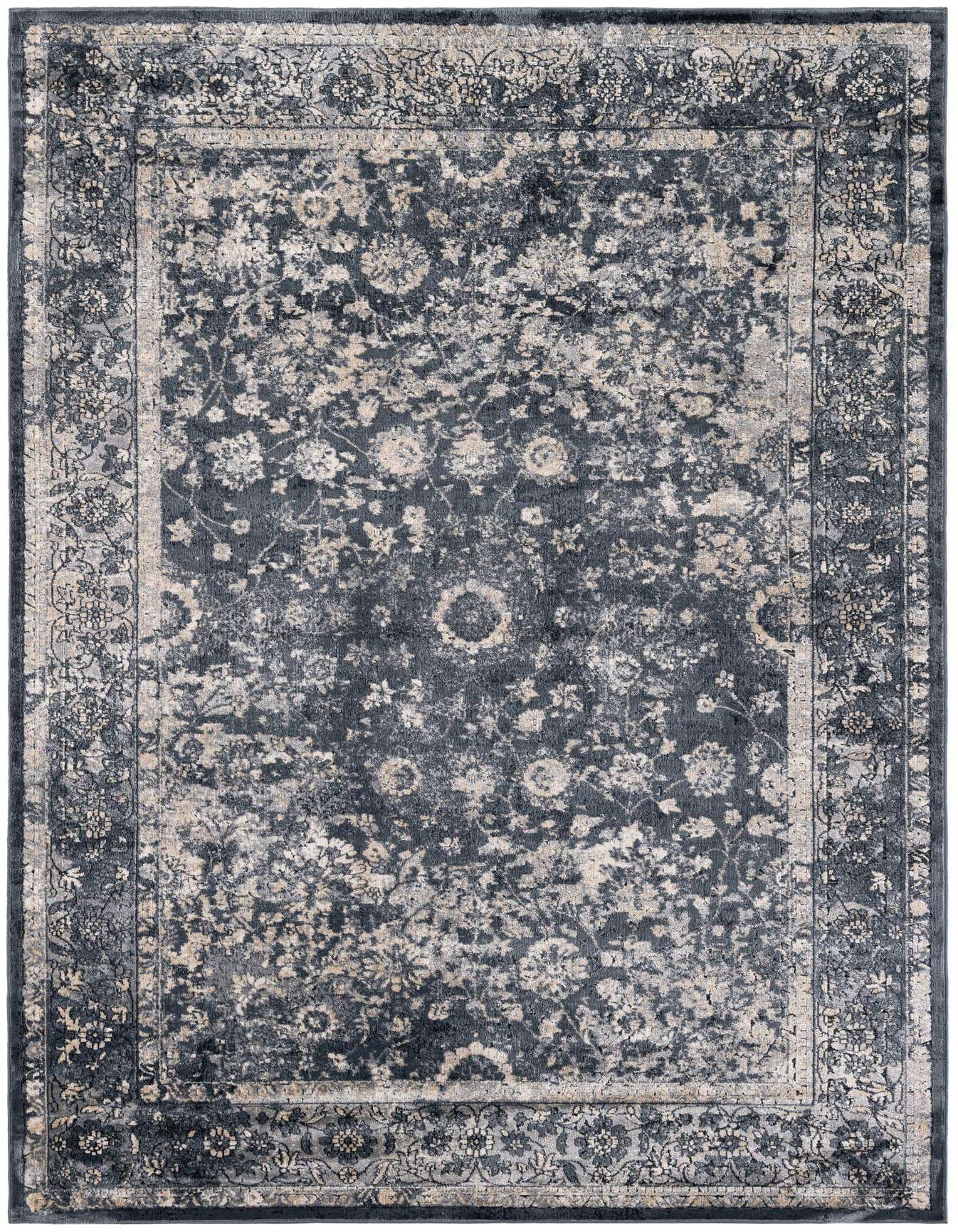 A 5x8 rectangular Eliza collection rug by Rugs.com, featuring a distressed modern floral pattern in shades of navy blue and light grey.