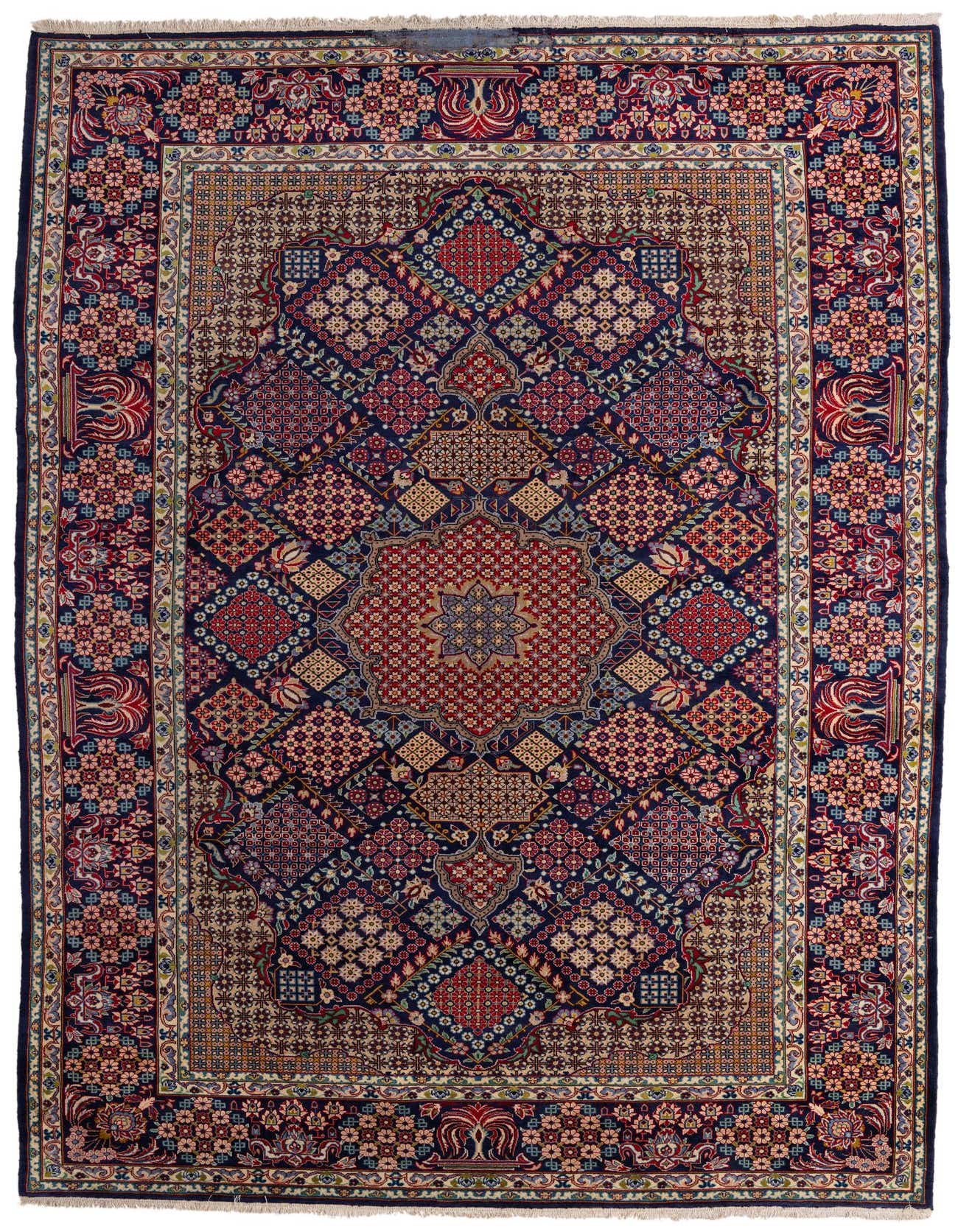 A large 10x14 rectangular Isfahan rug featuring a complex traditional Persian medallion and botanical pattern in deep blues, reds, and creams.