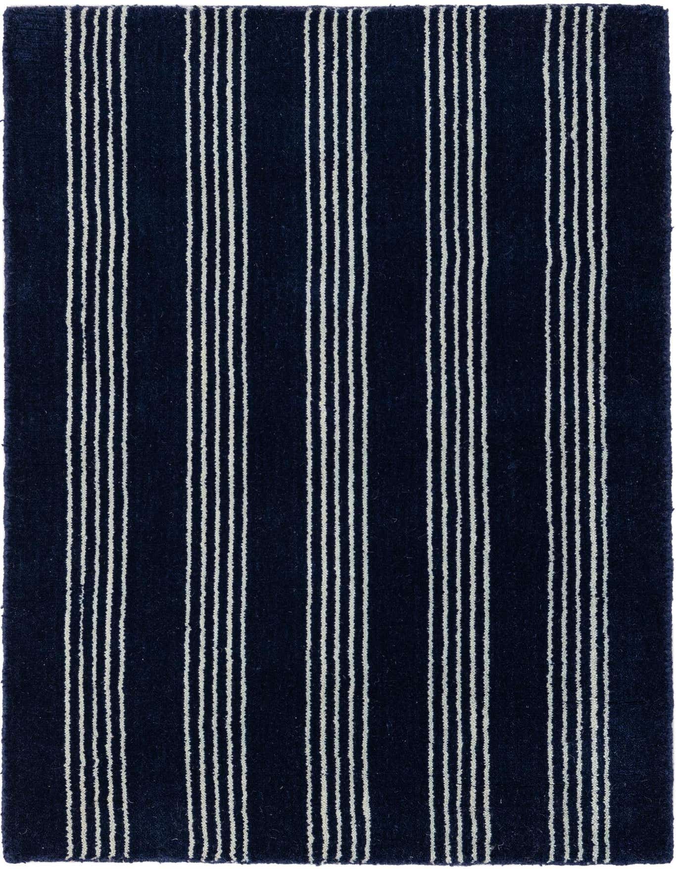 A 2x3 rectangular navy blue wool rug with evenly spaced vertical white stripes, ideal for a modern entryway.