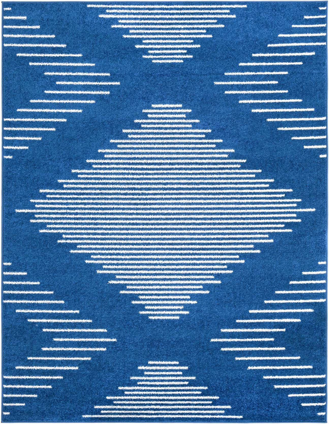 A 5x8 rectangular navy blue rug with a modern coastal pattern of white horizontal stripes forming large diamonds.