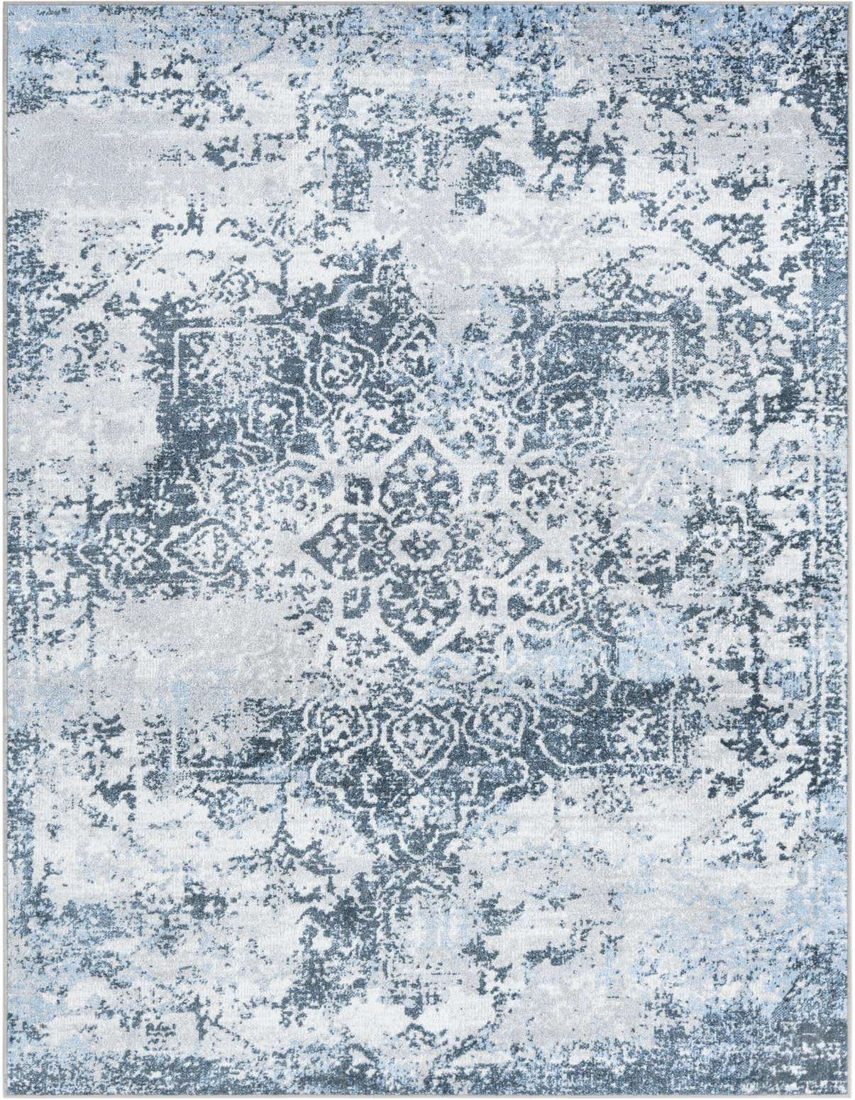A 5x8 rectangular Kamala Washable rug featuring a distressed traditional medallion pattern in shades of blue and white.