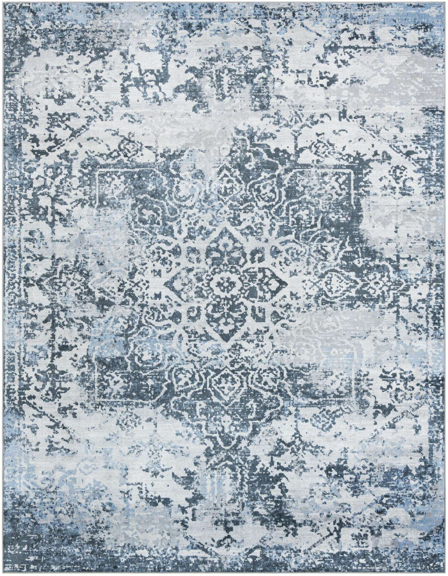 A 9x12 rectangular Kamala Washable rug featuring a distressed traditional medallion pattern in shades of blue and white.