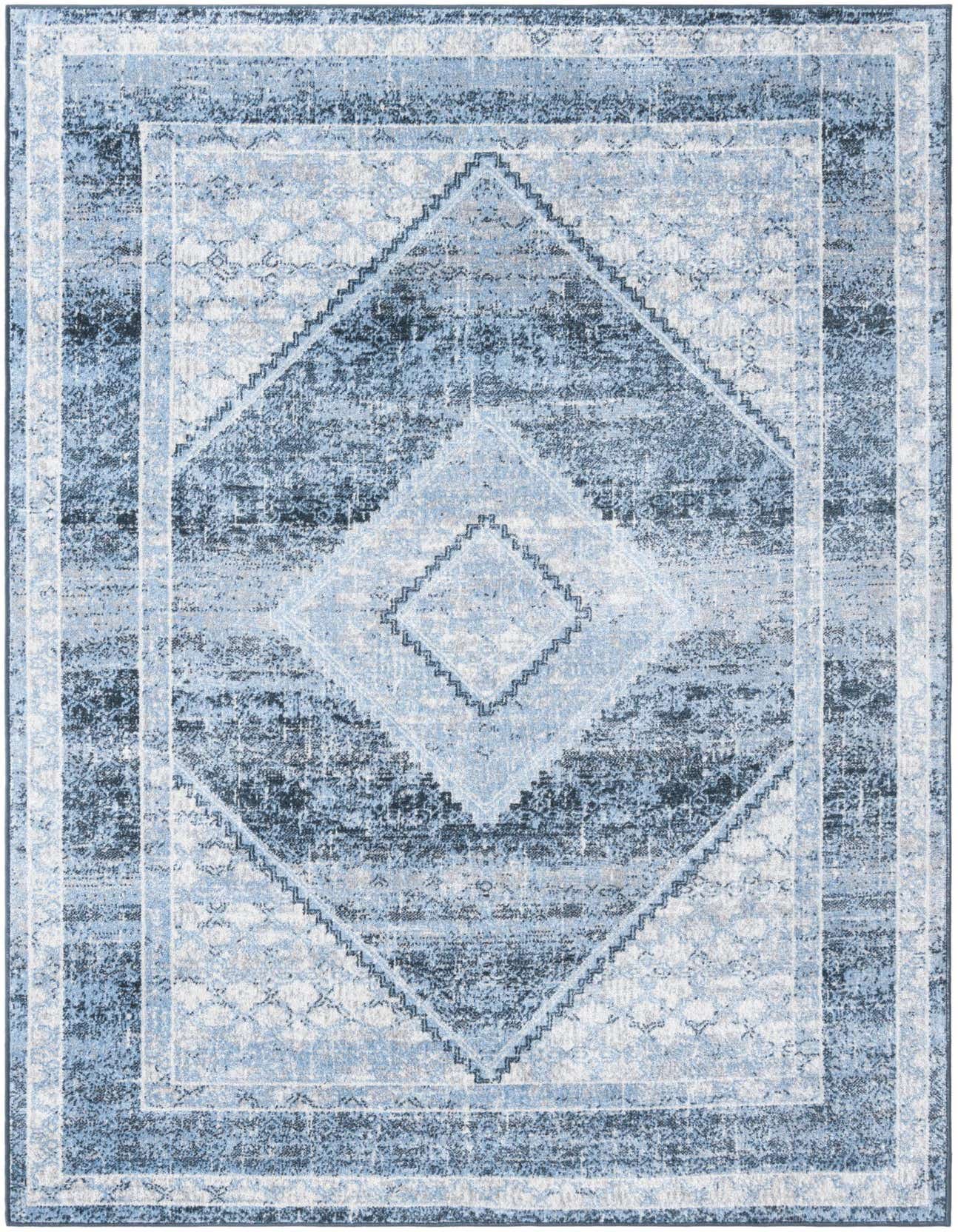 A rectangular 5x8 Kamala Washable rug in shades of blue with a distressed traditional medallion pattern.