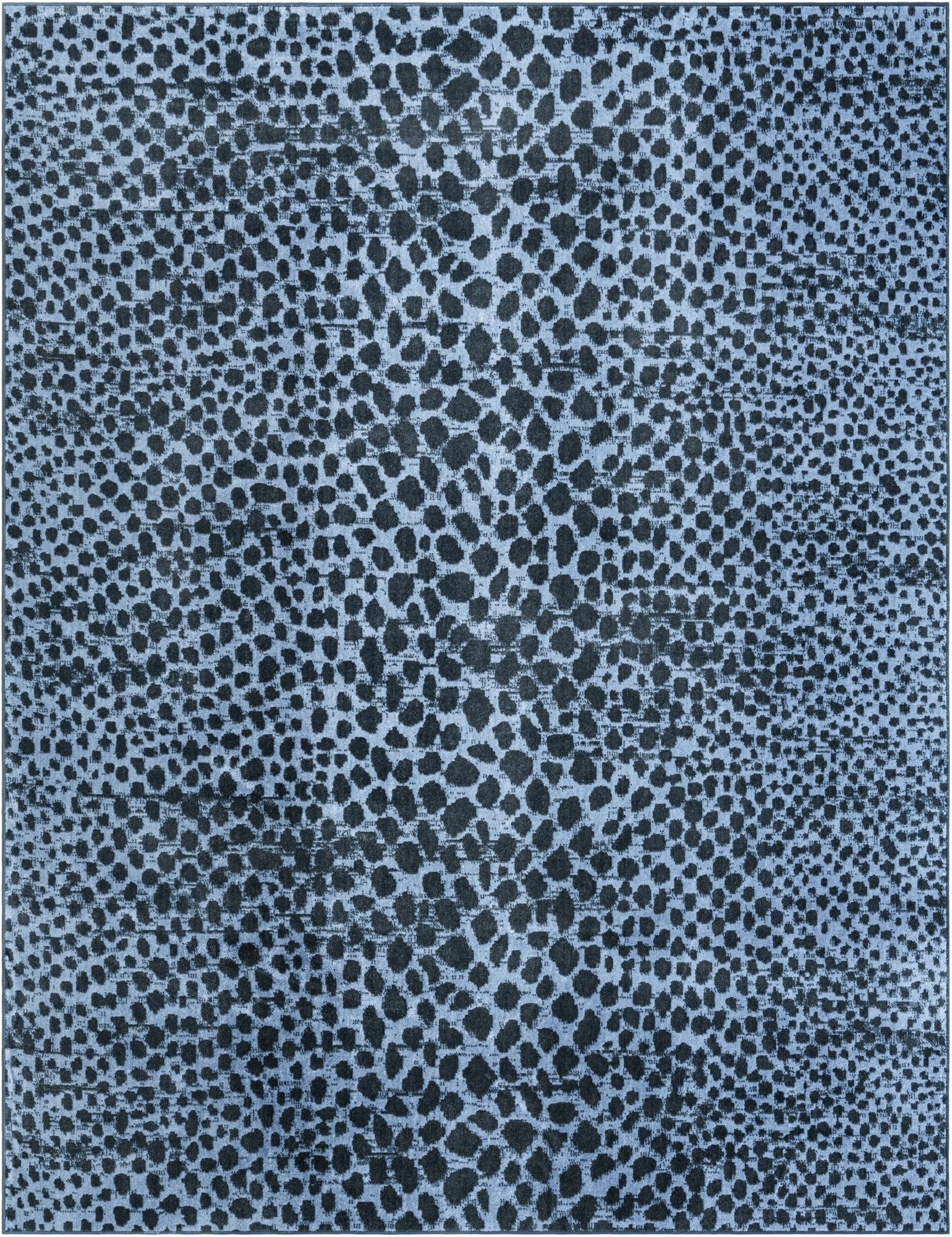 A rectangular 8x10 Kamala Washable rug in varying shades of blue, featuring a modern abstract spotted pattern.