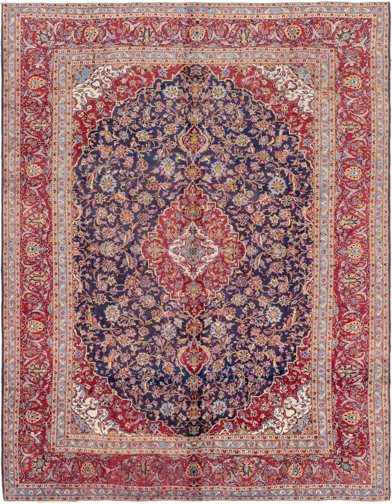 A large 10x13 rectangular navy blue and red Persian rug with an intricate botanical medallion pattern, ideal for a living room.