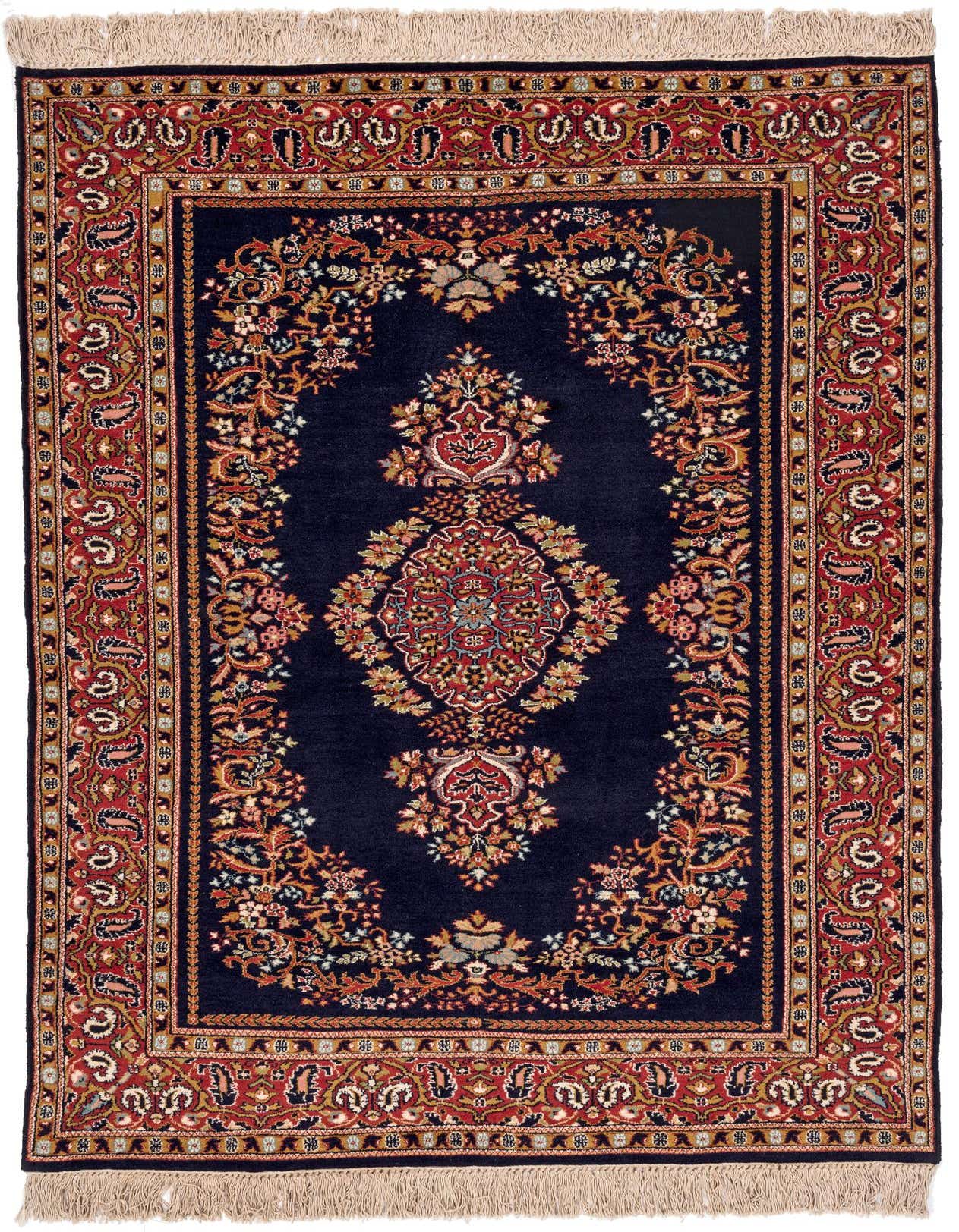 A 4x6 rectangular Kerman rug featuring a navy blue field with an ornate red and gold traditional medallion pattern, surrounded by a detailed floral border and fringe.