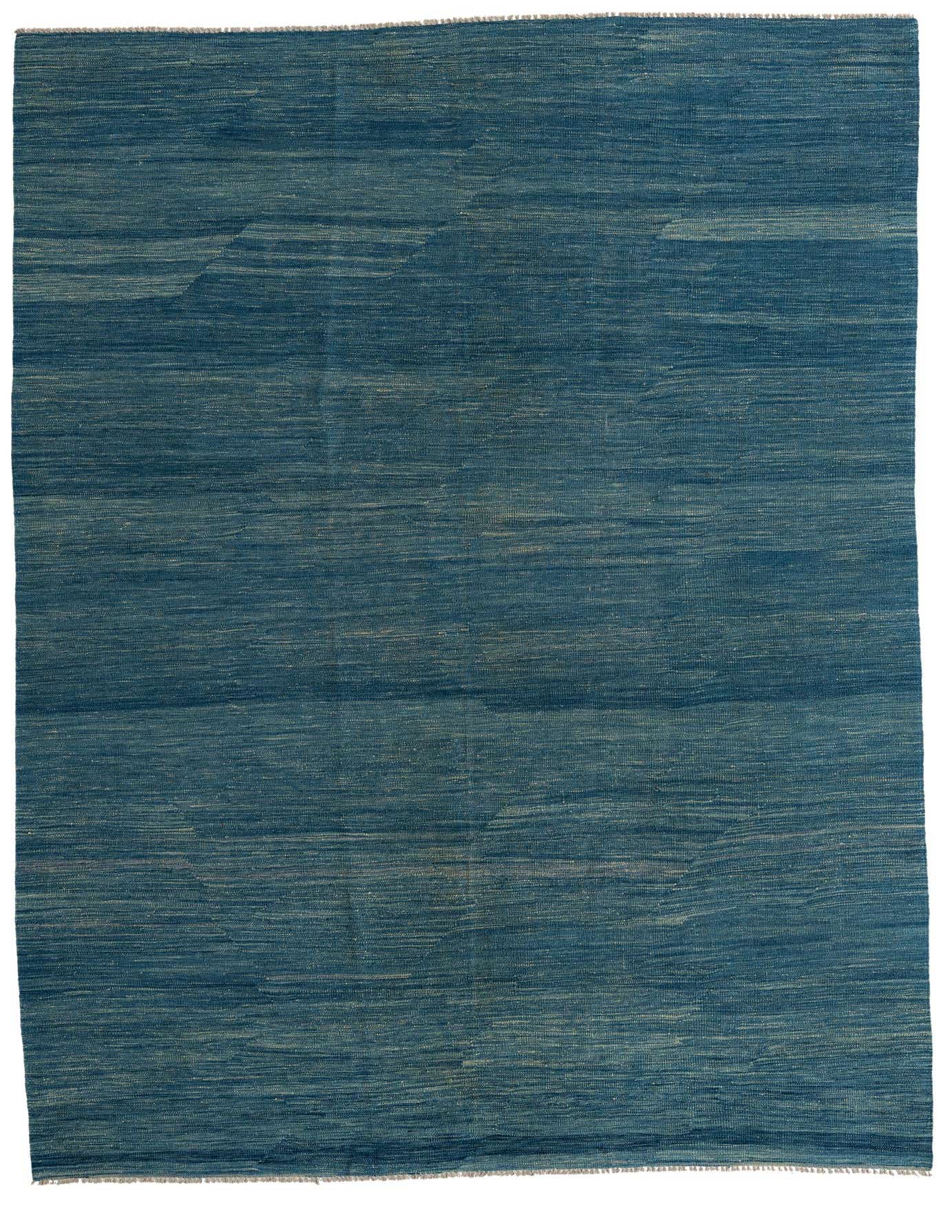 A 7x10 rectangular flatweave wool rug in varying shades of deep blue, featuring subtle horizontal striations and a Southwestern-inspired pattern.