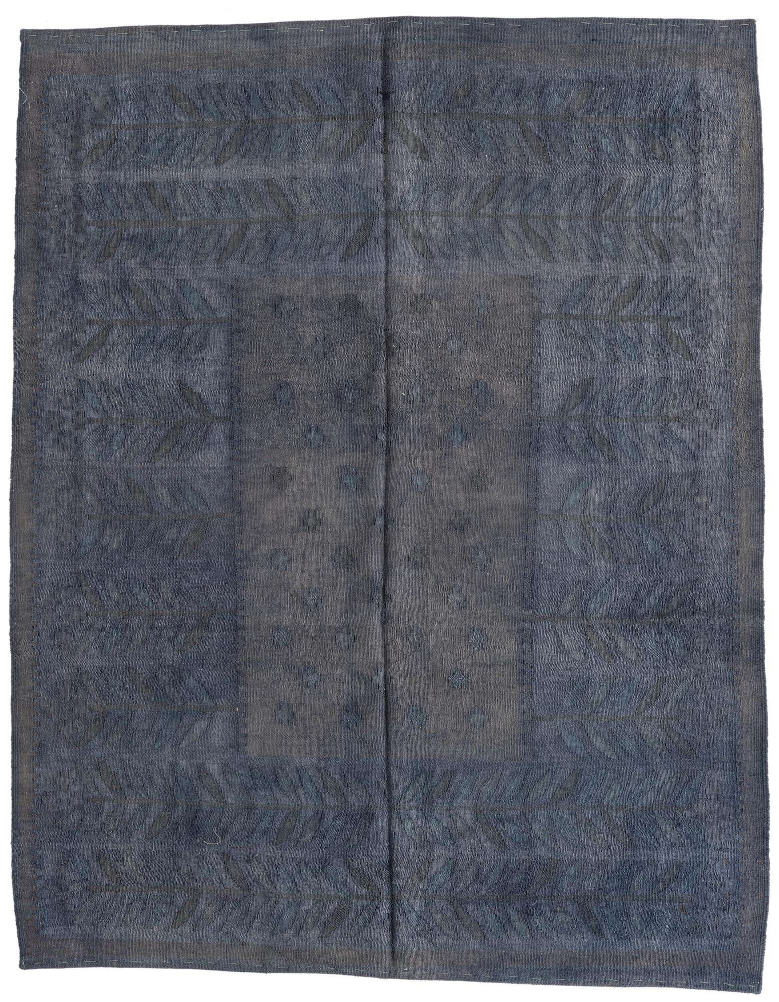 A 5x8 rectangular navy blue wool flatweave rug with a subtle tribal pattern, ideal for a living room.