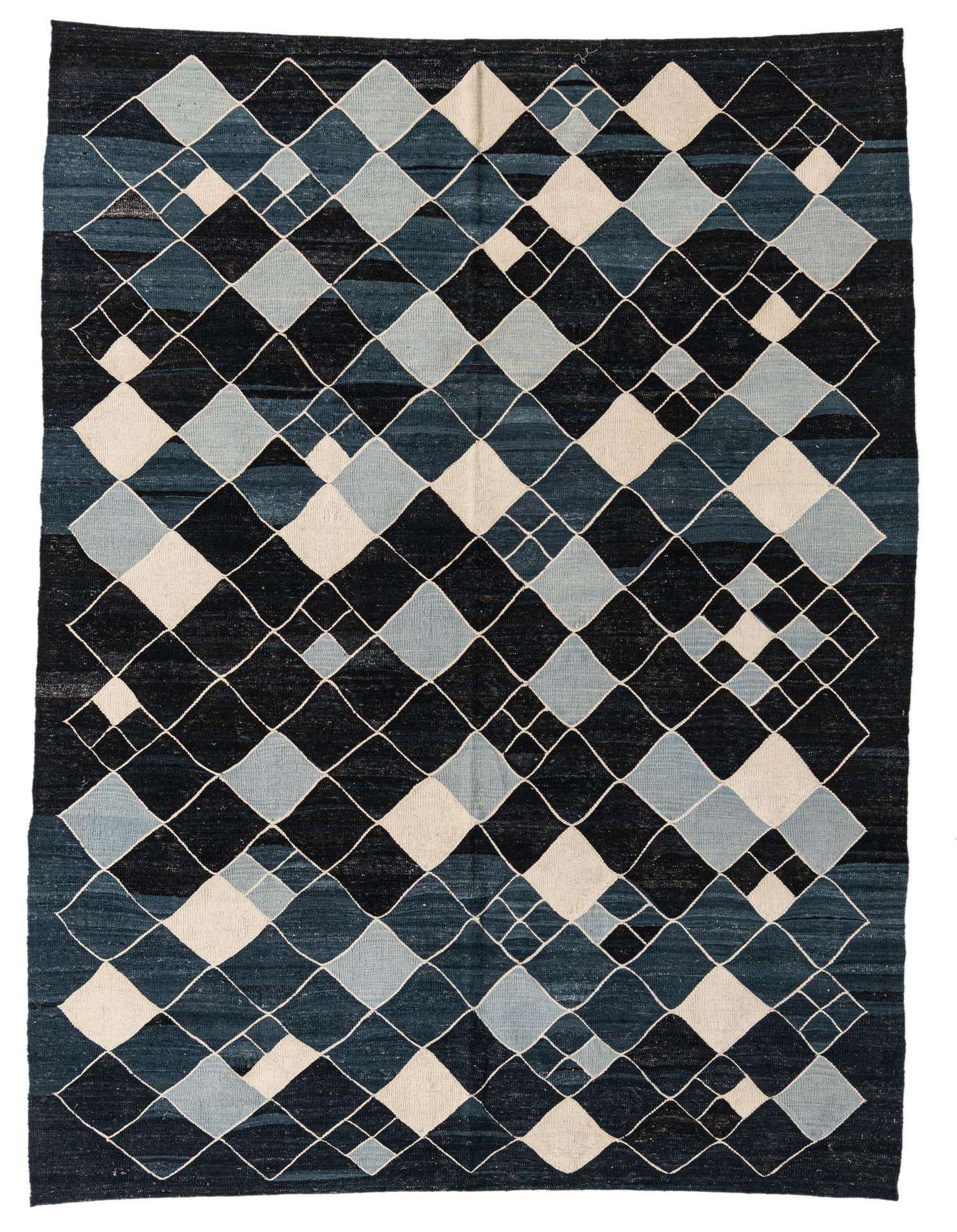 A 7x10 rectangular flatweave rug featuring a modern tribal pattern of interlocking diamonds in various shades of blue and off-white.
