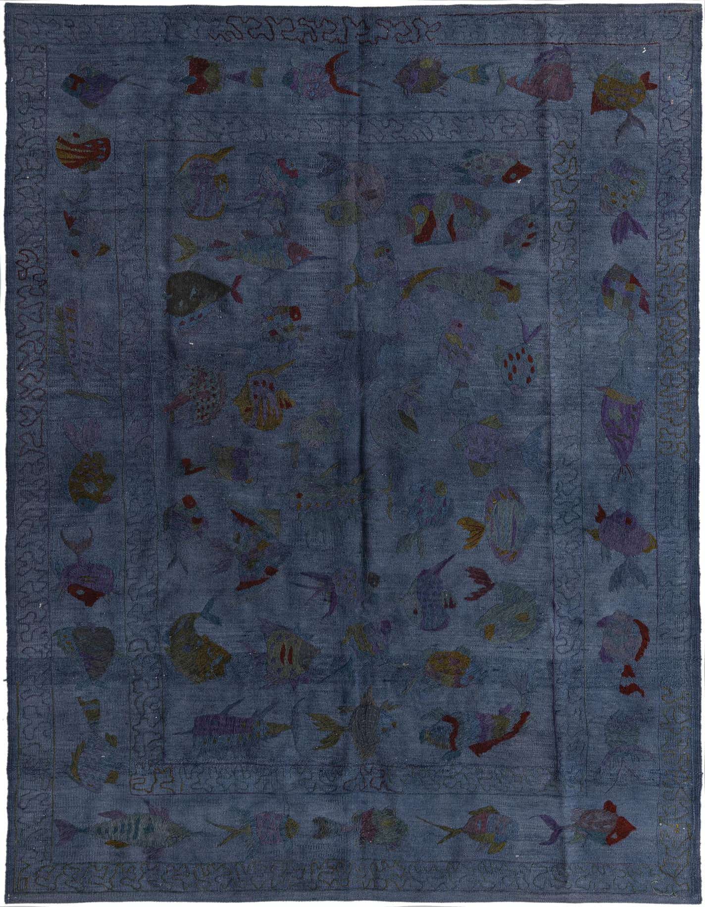 A 5x8 rectangular Kilim Suzani rug featuring a navy blue field with colorful abstract fish motifs and a tribal border.