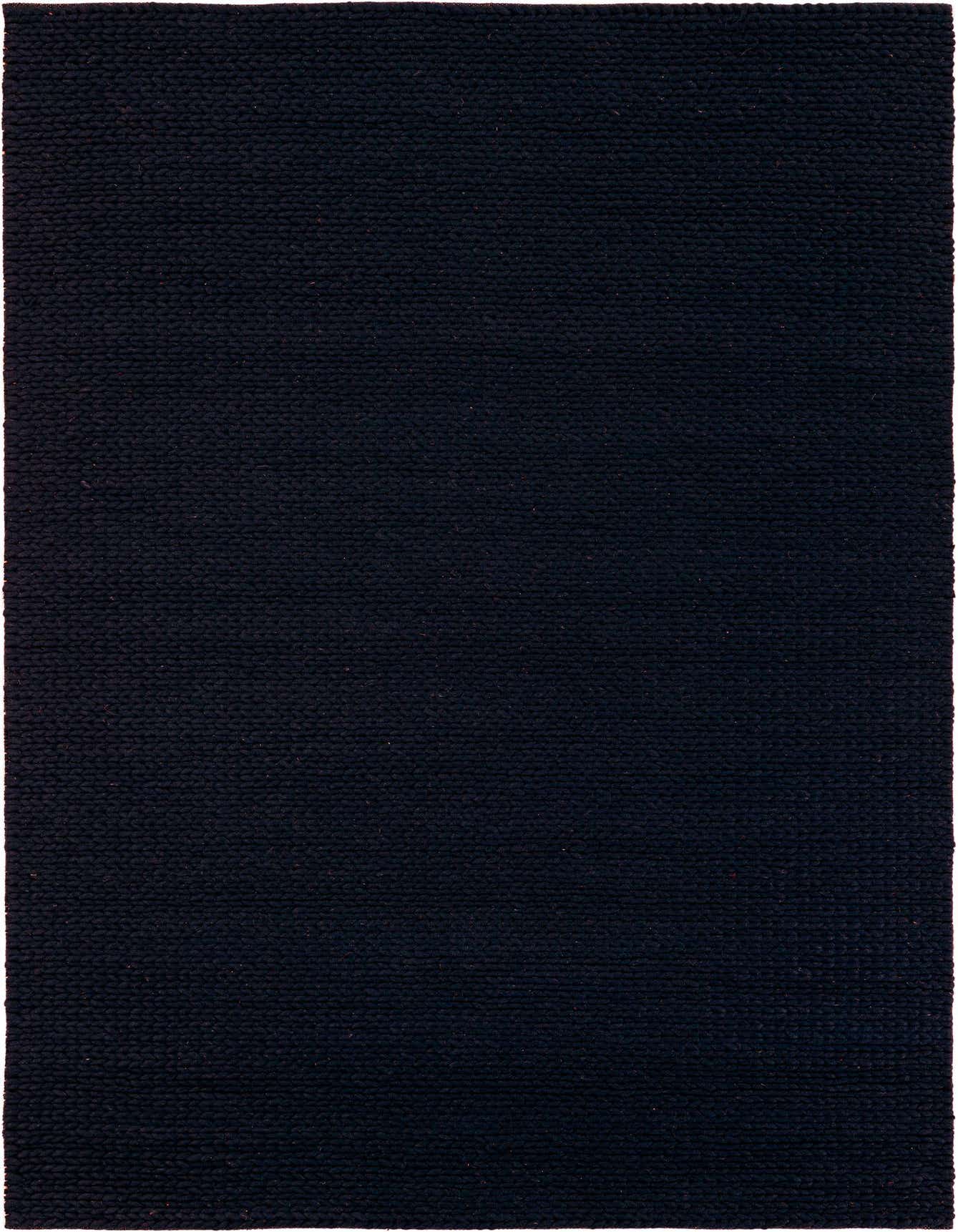 A close-up view of a 6x9 rectangular navy blue New Zealand wool rug with a textured, solid modern weave.