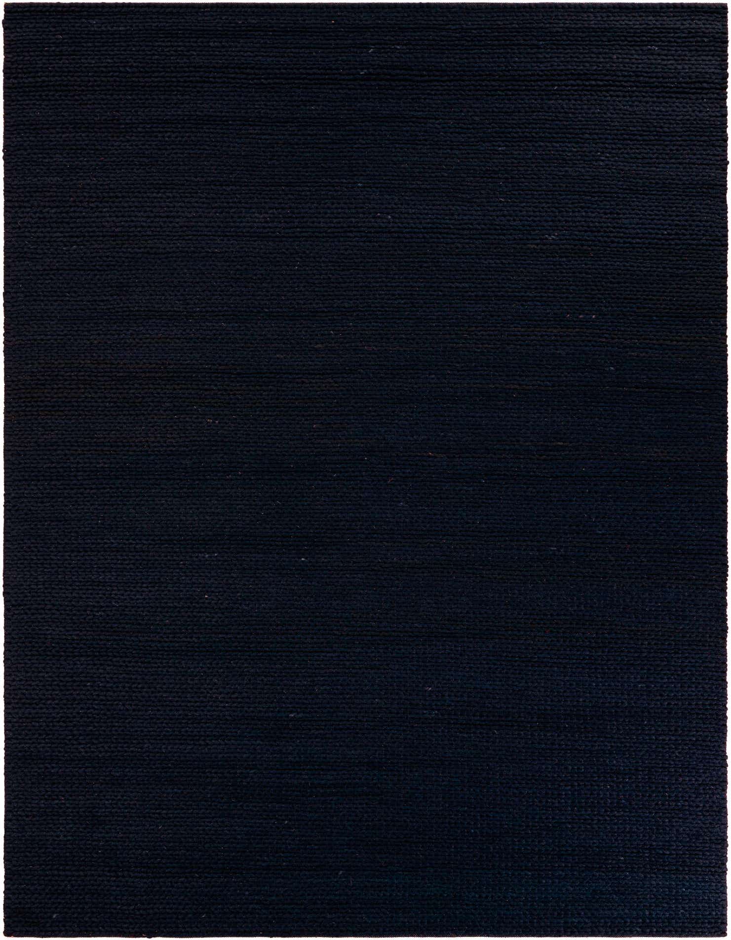 A close-up view of a 9x12 rectangular navy blue New Zealand wool area rug with a textured, solid pattern.