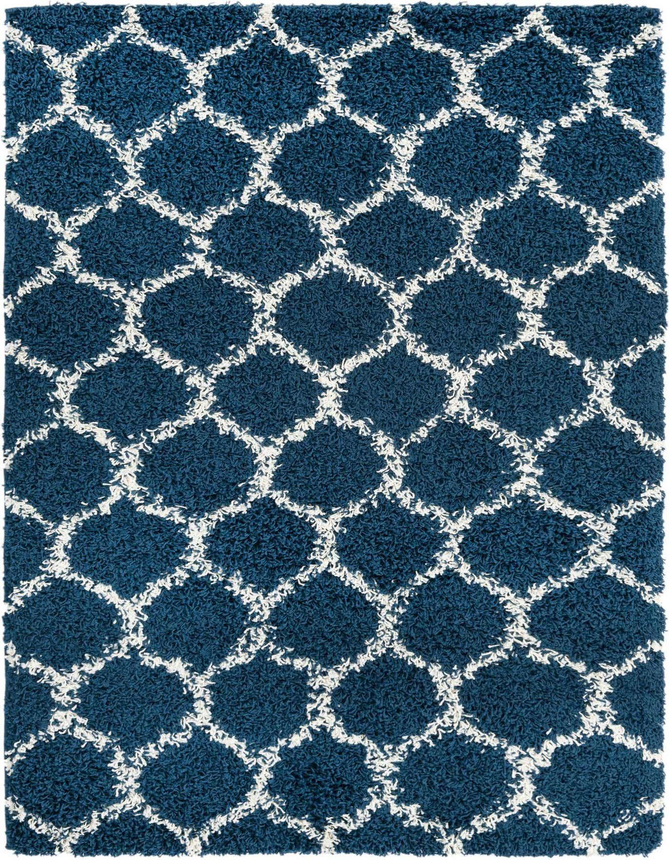 A 4x6 rectangular navy blue shag rug with a white modern lattice pattern, featuring a textured high-low pile.