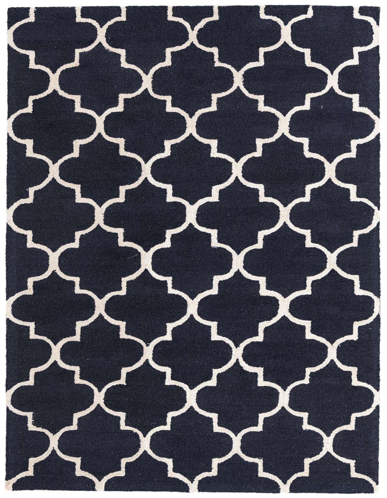 A 5x8 rectangular Luna rug with a navy blue background and a bold white modern abstract quatrefoil pattern.