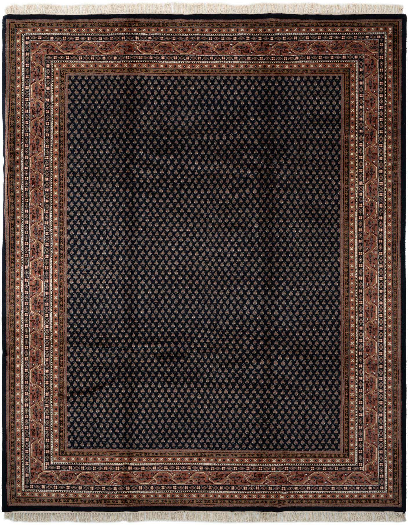 A rectangular 8x11 navy blue traditional wool rug with a detailed rust-colored border and fringe, suitable for a living room.