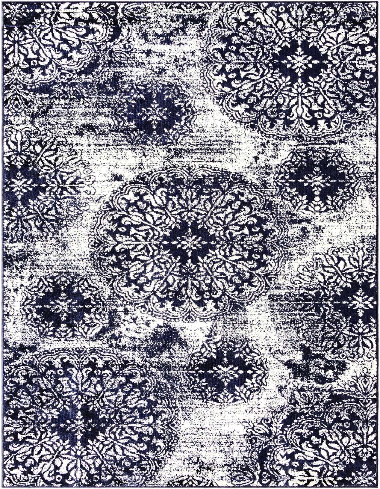 A 5x8 rectangular navy blue and white distressed area rug with large traditional floral medallions.