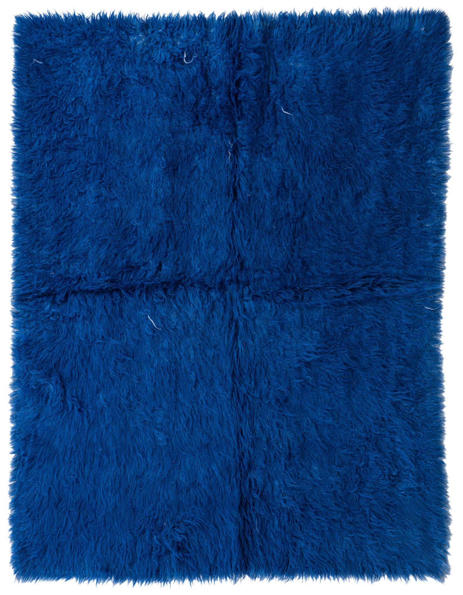 A plush 5x8 rectangular shag rug in a vibrant navy blue, featuring a soft, textured wool pile.