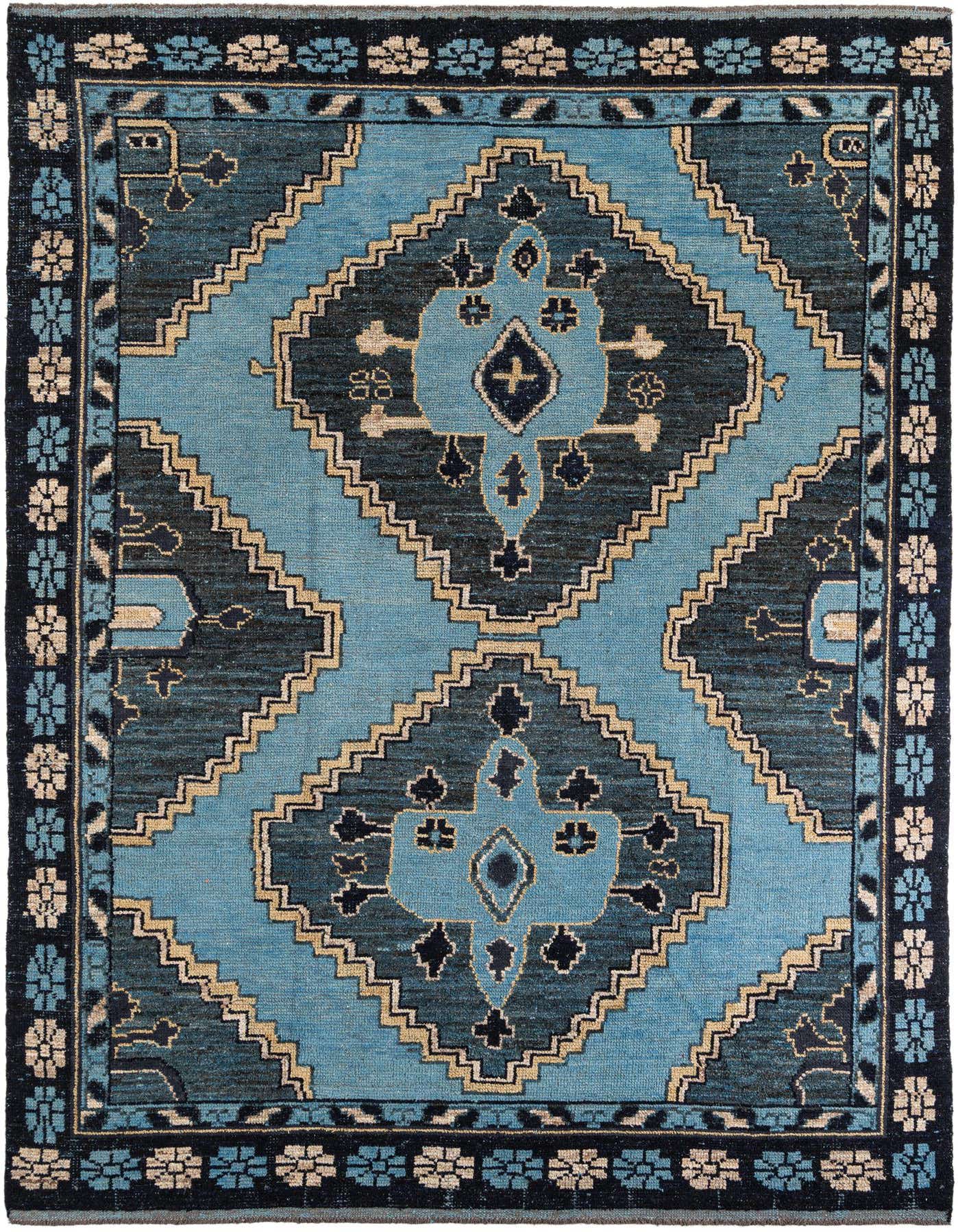 A 9x12 rectangular Moroccan rug featuring a tribal medallion pattern in varying shades of blue, with a shag pile.