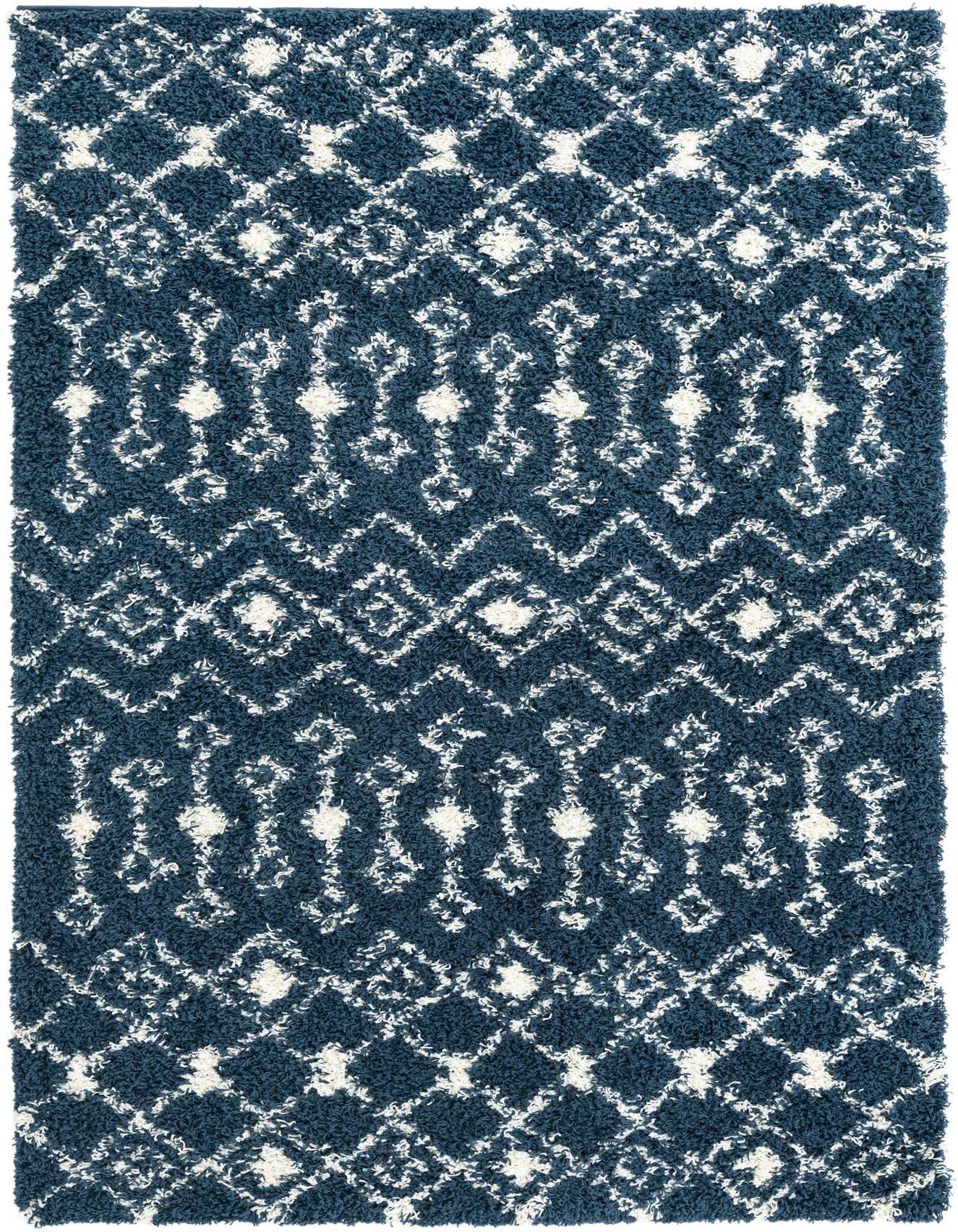 A 5x8 rectangular navy blue shag rug with a white modern tribal trellis pattern, perfect for a living room.