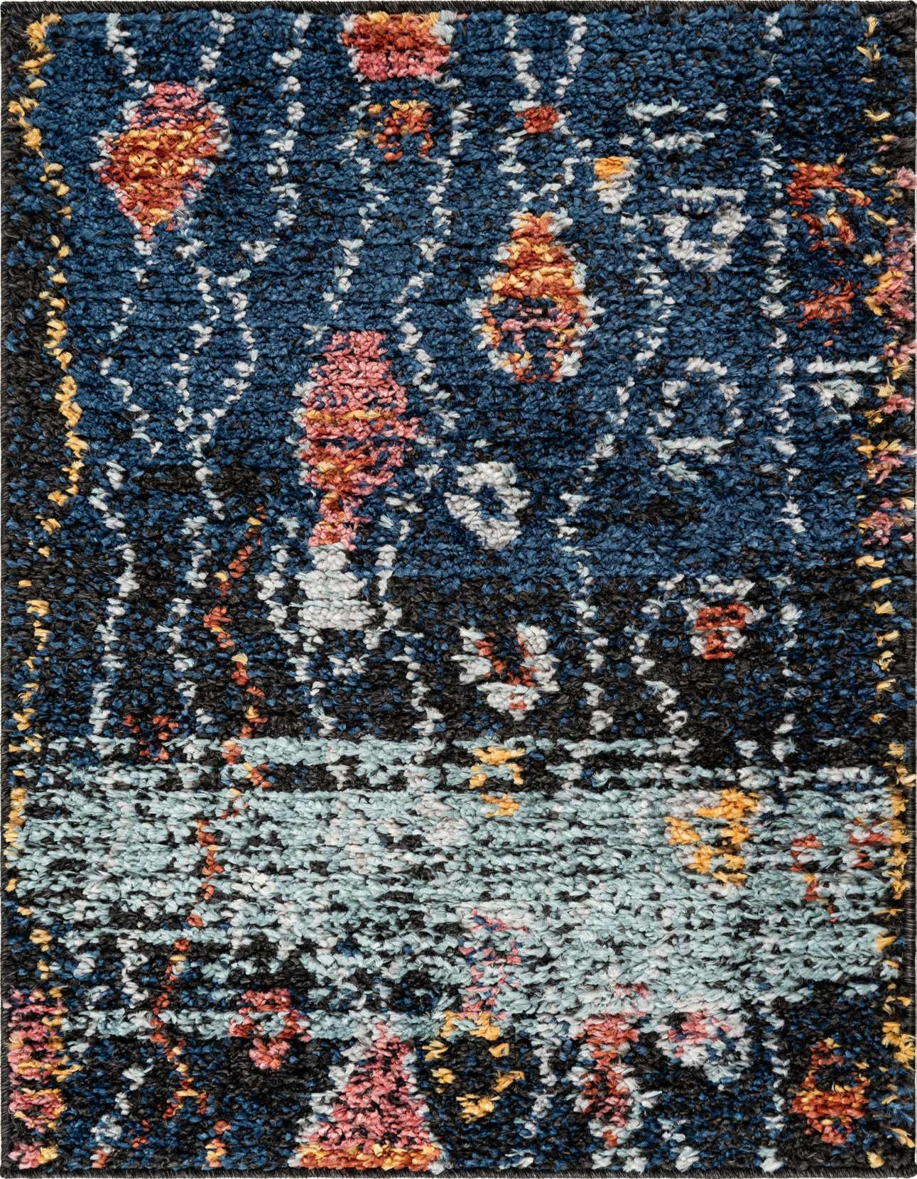 A rectangular 2x3 navy blue shag rug featuring a bohemian tribal pattern with accents of light blue, pink, orange, and white.
