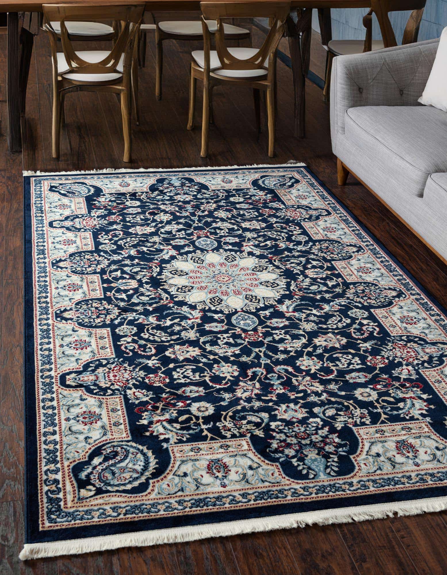 A 3x5 rectangular navy blue traditional rug with a central medallion and intricate botanical patterns in cream, light blue, and red.