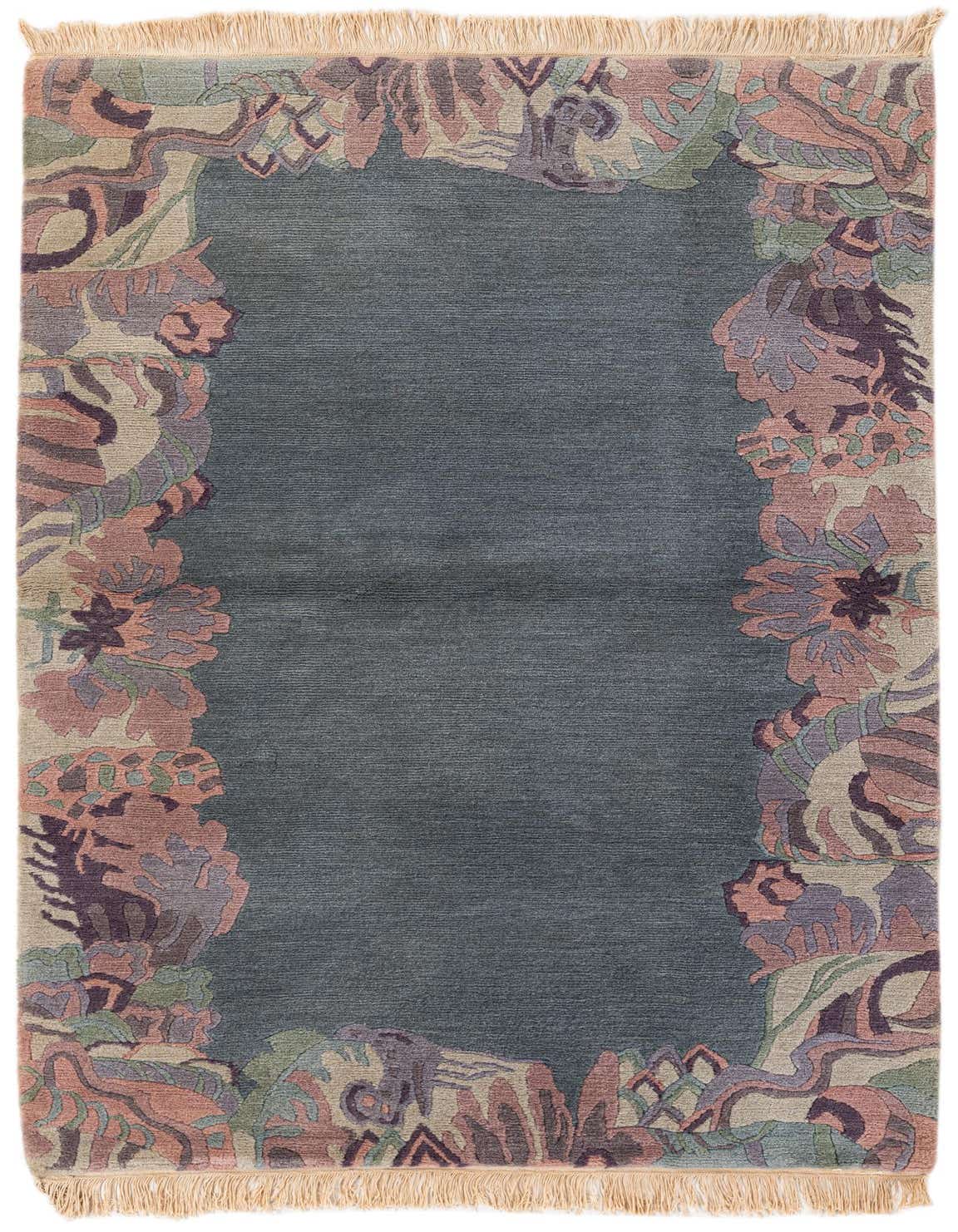 A 3x5 rectangular navy blue wool rug with a high pile, featuring a modern abstract border in muted pink, purple, and green tones, ideal for indoor spaces.