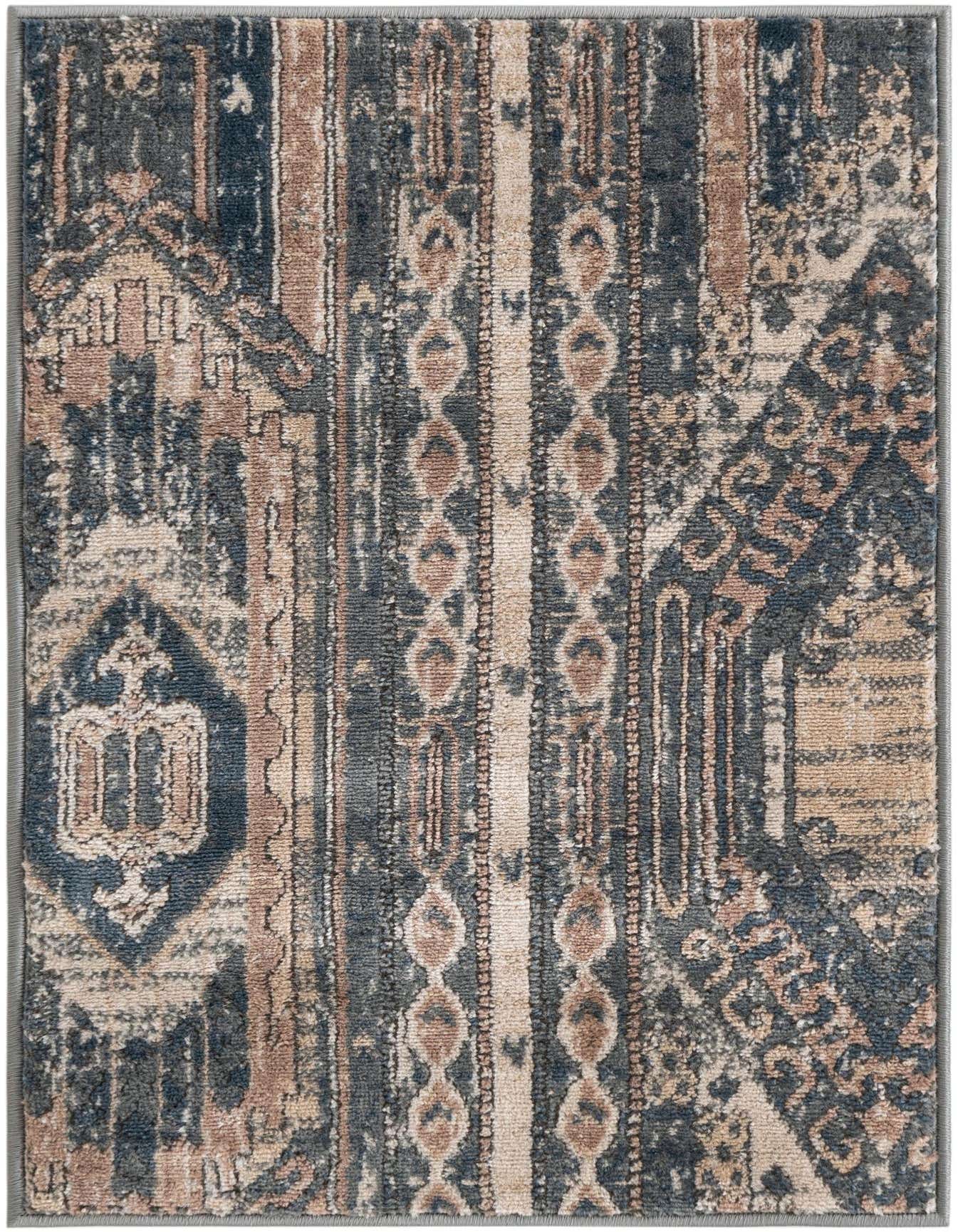 A 2x3 rectangular Rugs.com Oregon rug featuring a distressed bohemian pattern in shades of navy blue, beige, and brown.