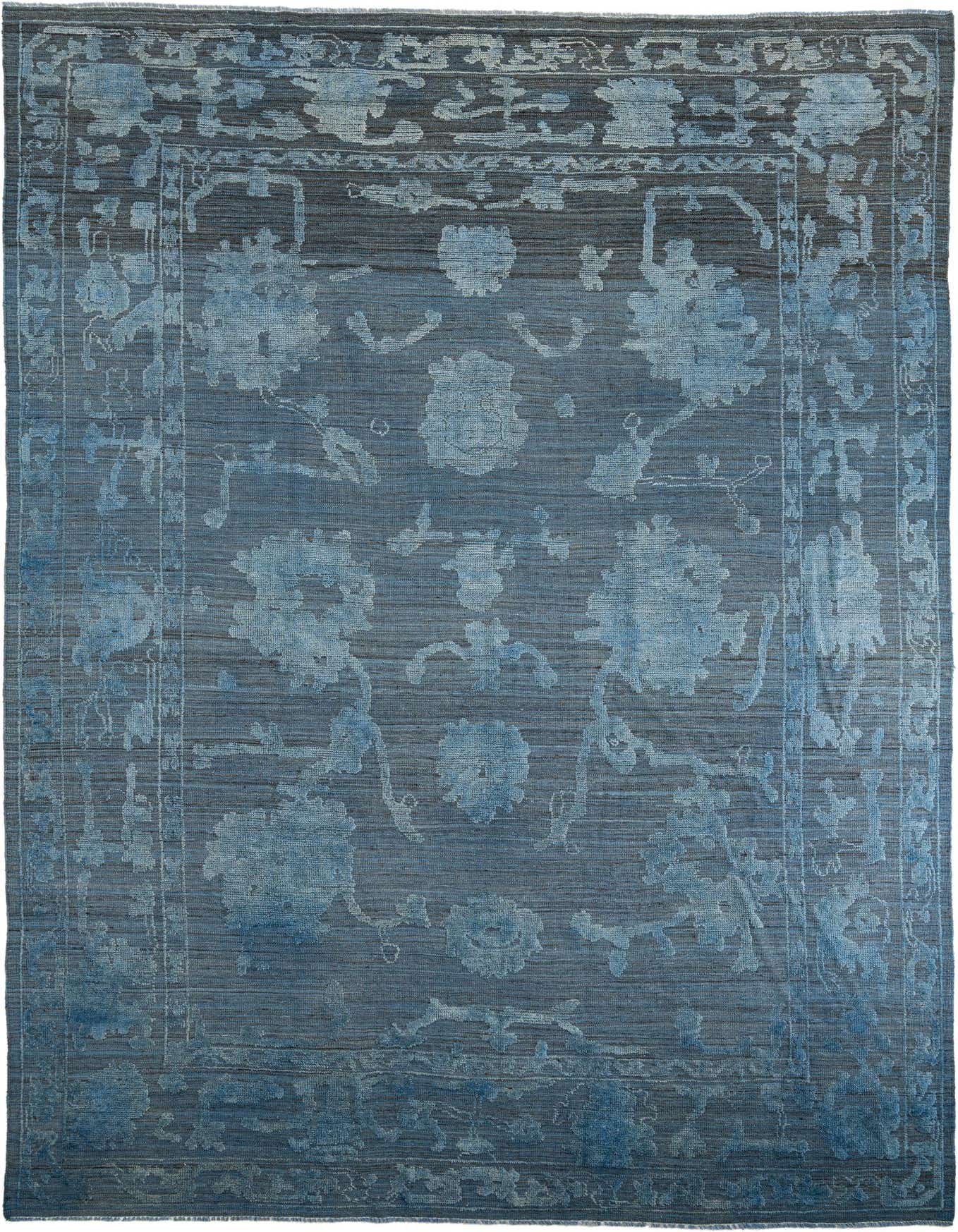 A 10x14 rectangular Oushak rug in varying shades of blue, featuring a modern floral pattern and a medium pile.