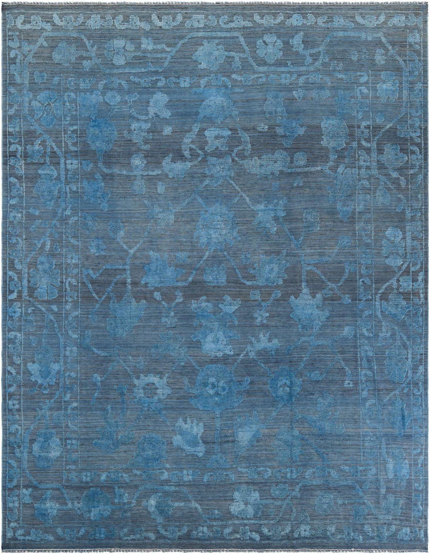 A 9x12 rectangular Oushak rug in varying shades of blue, featuring a modern floral pattern with a distinct border.