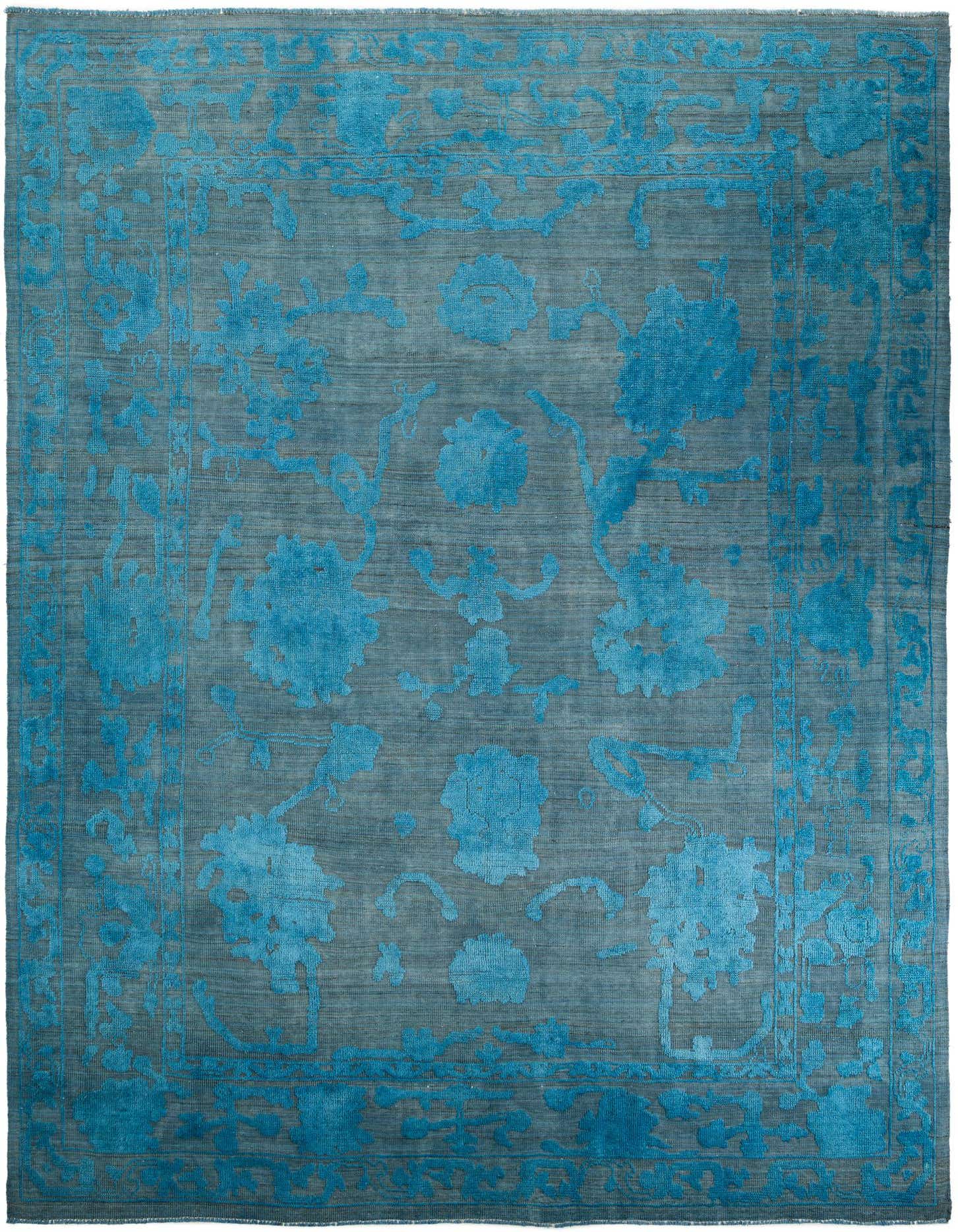 A 10x14 rectangular Oushak rug in varying shades of blue, featuring a modern floral pattern with a distinct border.