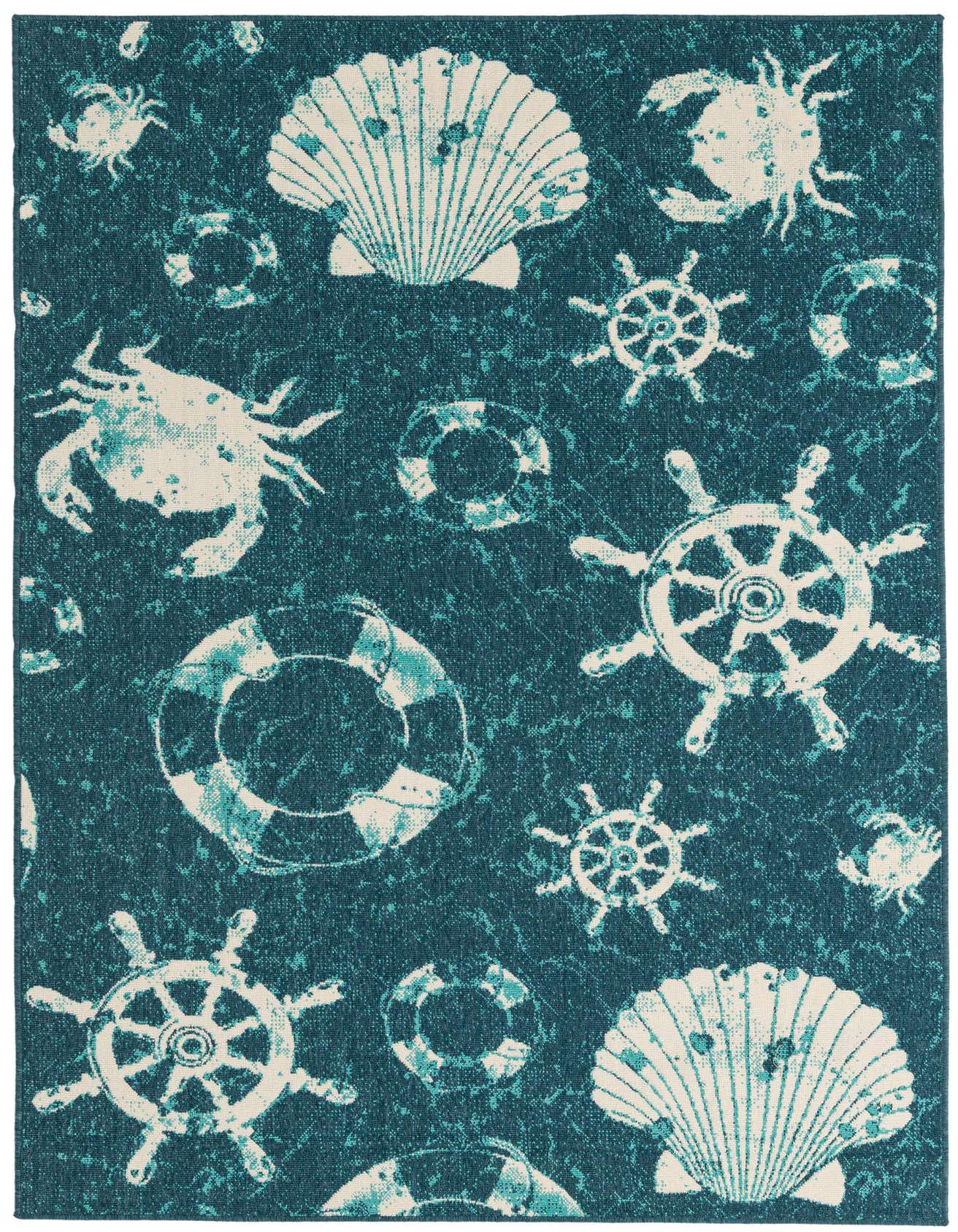 A 5x8 rectangular navy blue indoor/outdoor rug with a coastal pattern of white crabs, seashells, life preservers, and ship wheels.
