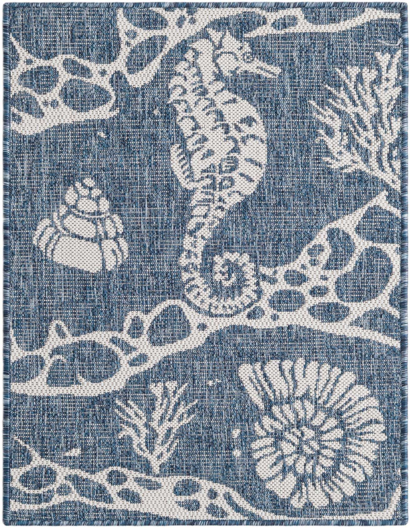 A 2x3 rectangular navy blue and white indoor/outdoor rug with a coastal pattern featuring a seahorse, coral, and seashells.