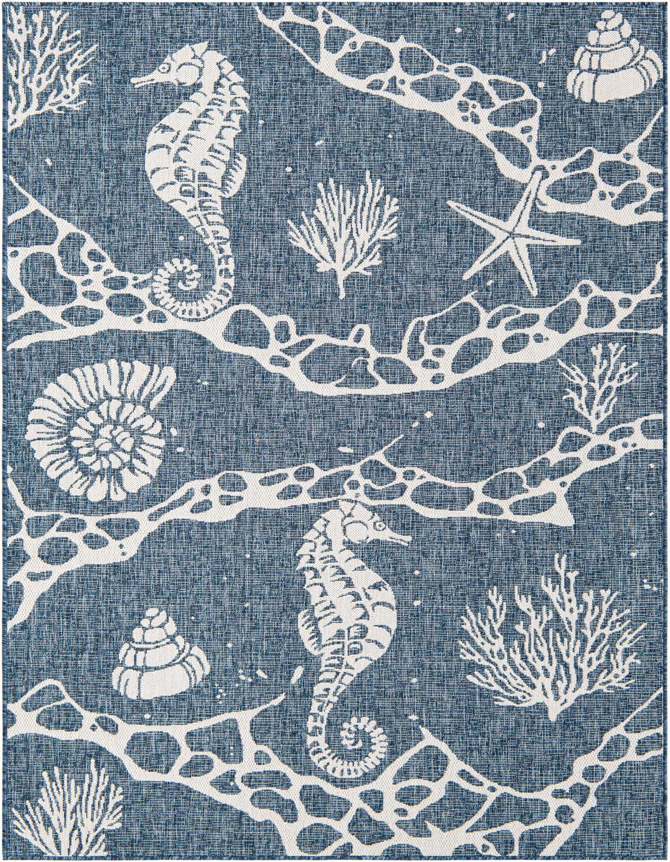 A 5x8 rectangular navy blue and white coastal rug featuring seahorses, starfish, seashells, and coral patterns.