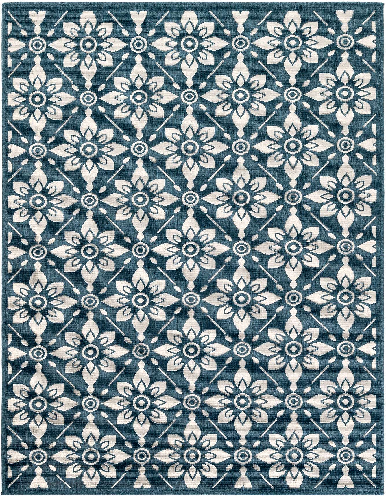 A 6x9 rectangular navy blue and cream flatweave rug with a modern floral lattice pattern, suitable for indoor or outdoor use.