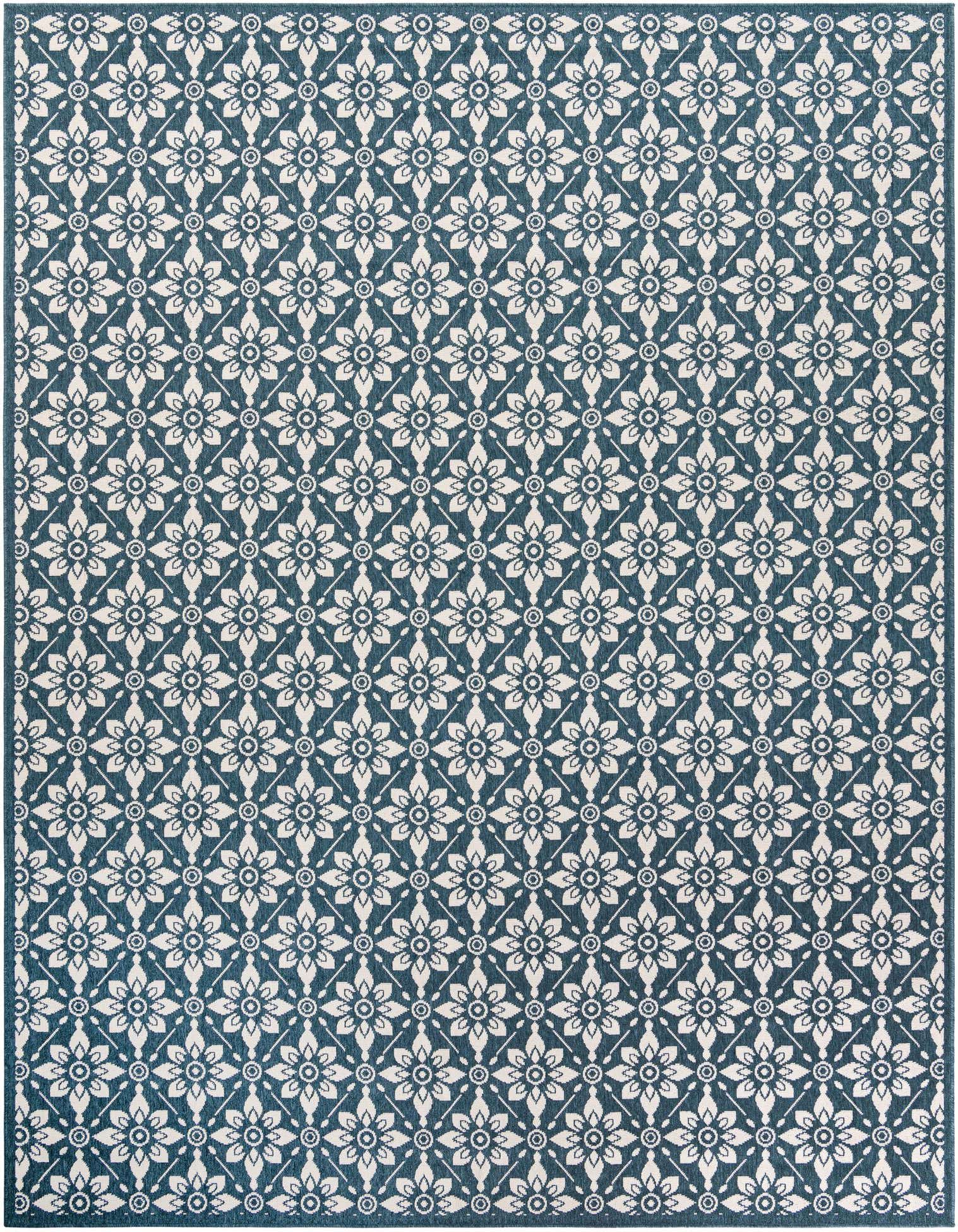 A 9x12 rectangular Rugs.com Outdoor Lattice rug with a repeating modern floral pattern in navy blue and off-white.
