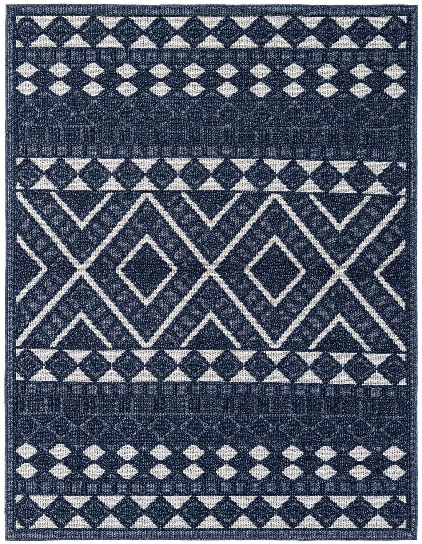 A 5x8 rectangular navy blue and white modern rug with a bold geometric diamond pattern, suitable for indoor/outdoor use.