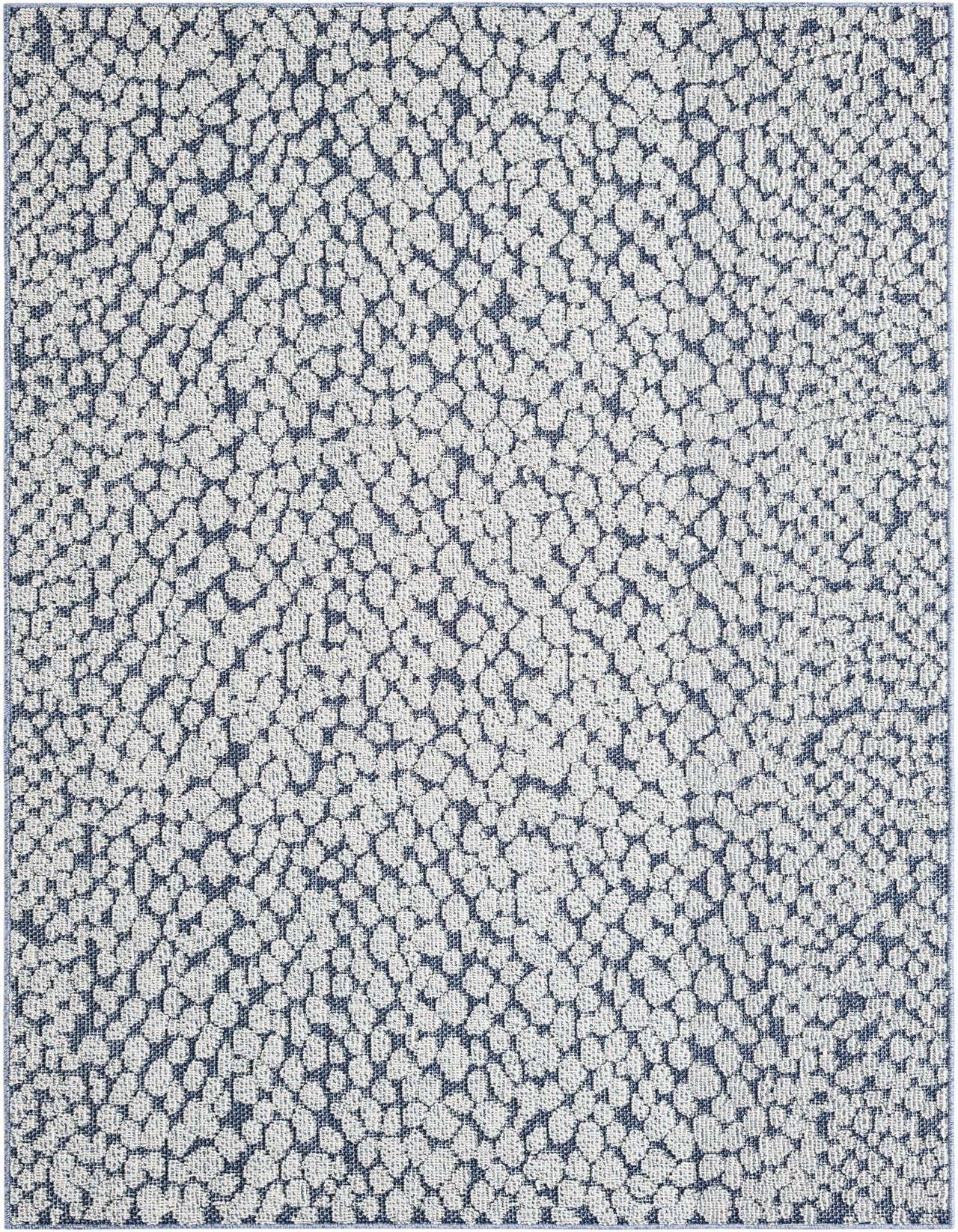 A 5x8 rectangular indoor/outdoor rug with a modern, abstract pattern in varying shades of blue, resembling pebbles or an animal print.