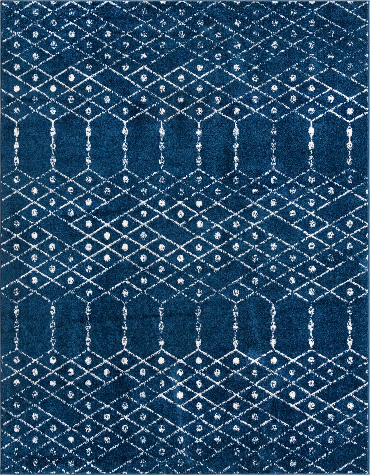 A rectangular 8x10 Paxon Trellis rug in deep navy blue with a distressed white tribal trellis pattern, ideal for a living room.