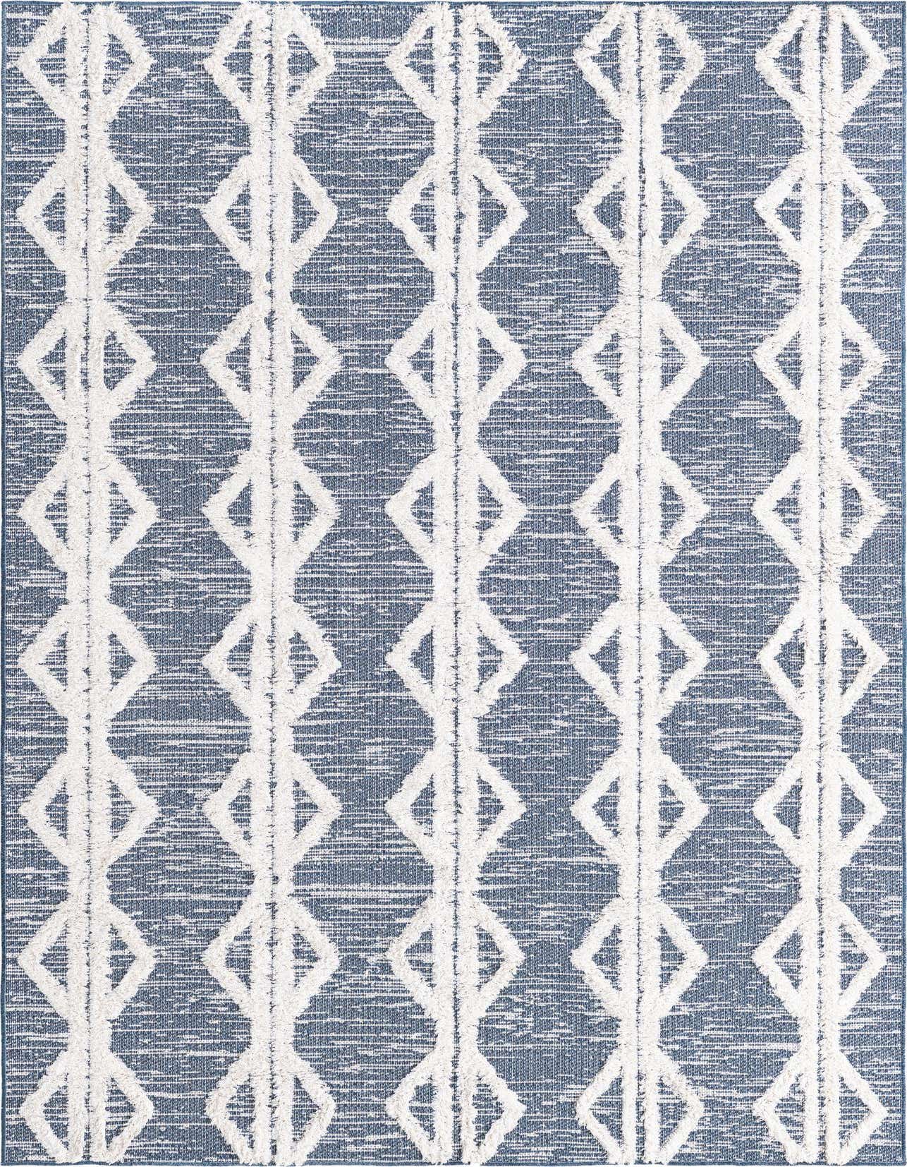 A 5x8 rectangular navy blue and white tribal rug with a textured, high-pile diamond pattern.