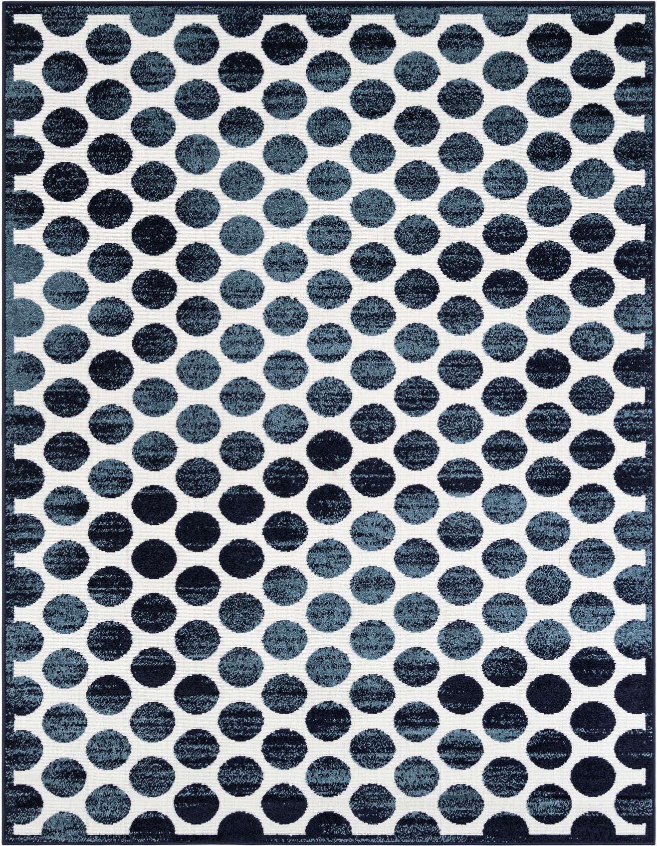 A 6x9 rectangular modern rug featuring an abstract pattern of varying shades of blue polka dots on a white background.