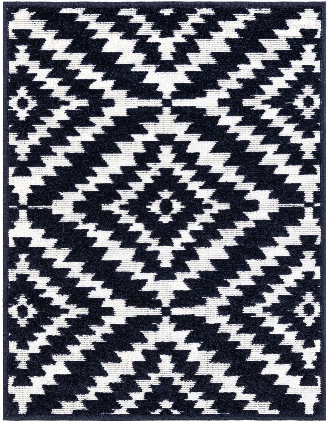 A 2x3 rectangular Rugs.com Sabrina Soto Outdoor rug with a repeating modern geometric pattern in navy blue and white.