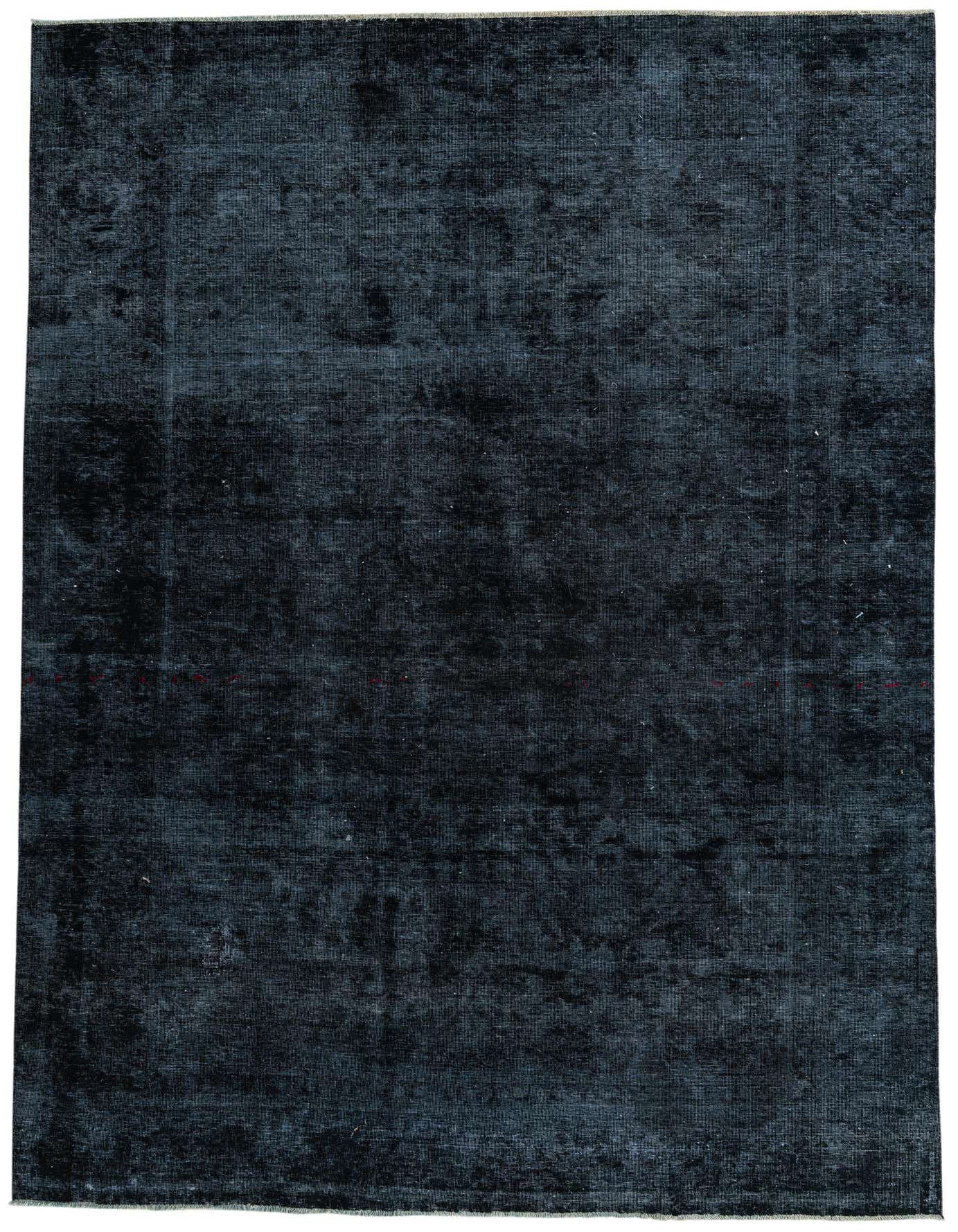 An 8x11 rectangular navy blue wool rug with a subtle, distressed Persian pattern, ideal for a living room.