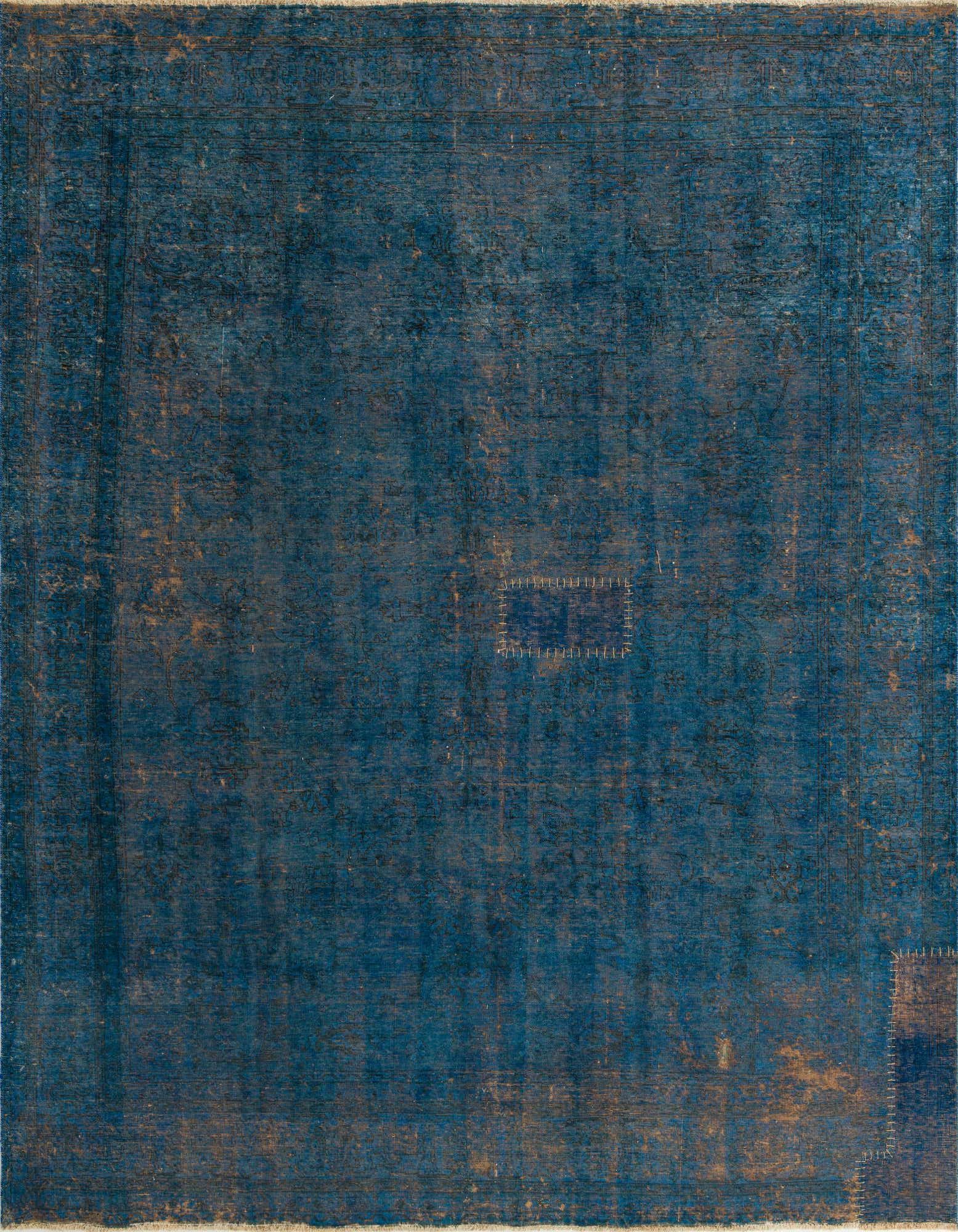 A 9x11 rectangular Ultra Vintage rug in deep blues with a distressed Persian medallion pattern and visible handmade repairs.