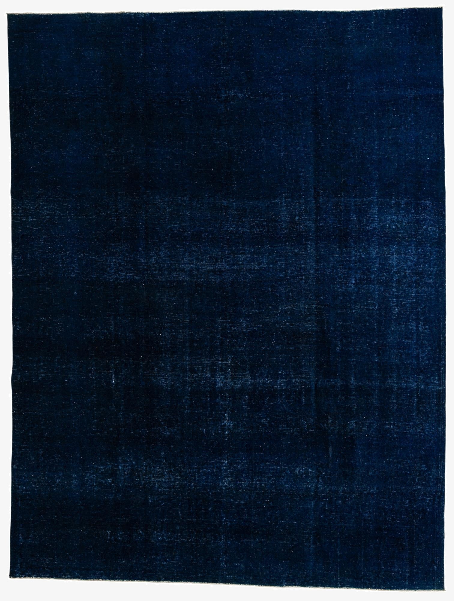 A large 10x13 rectangular navy blue wool area rug with a subtle, distressed vintage Persian pattern.