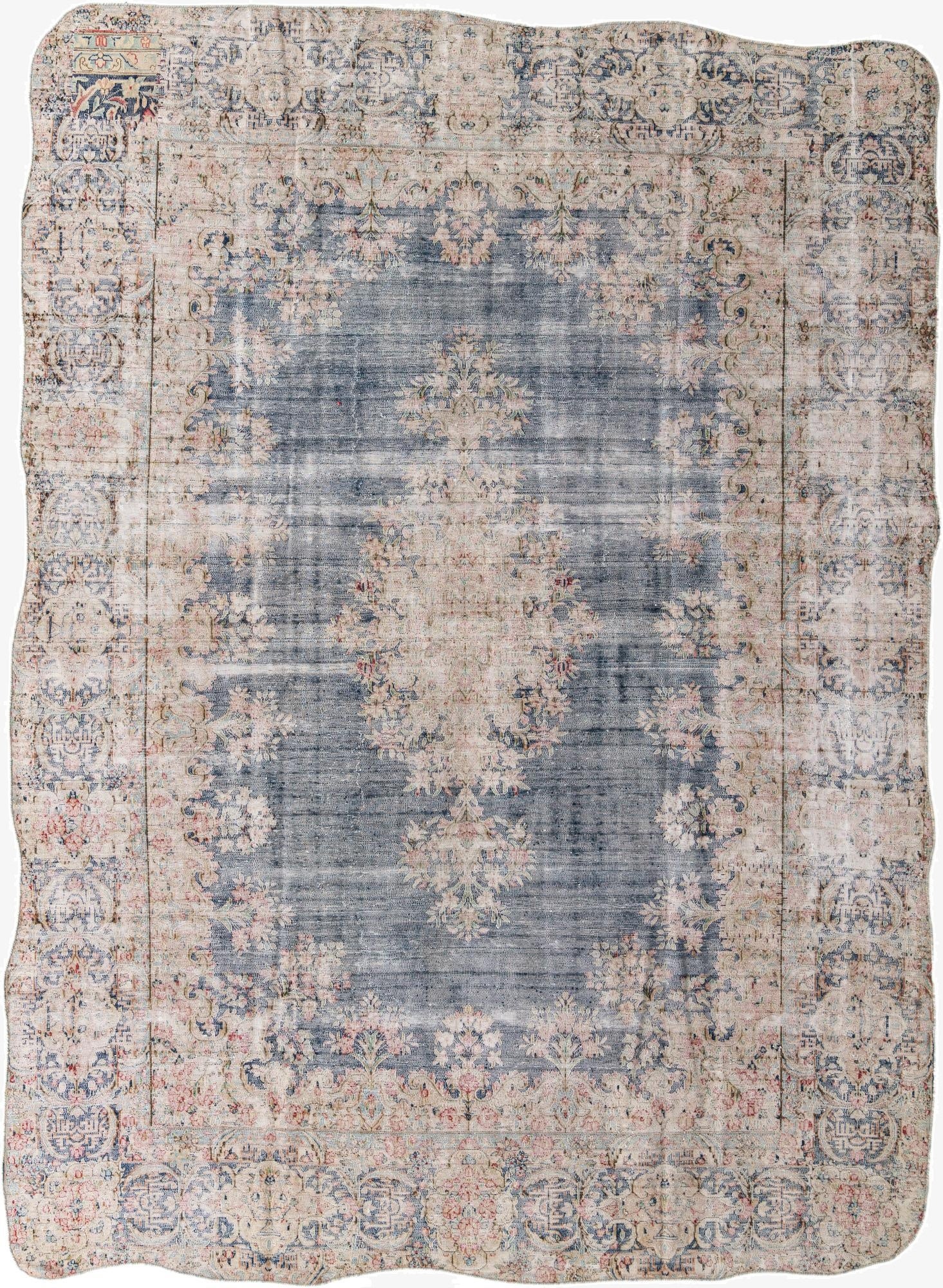 A large 10x12 rectangular Ultra Vintage rug with a faded navy blue center and distressed light pink and beige Persian floral patterns.
