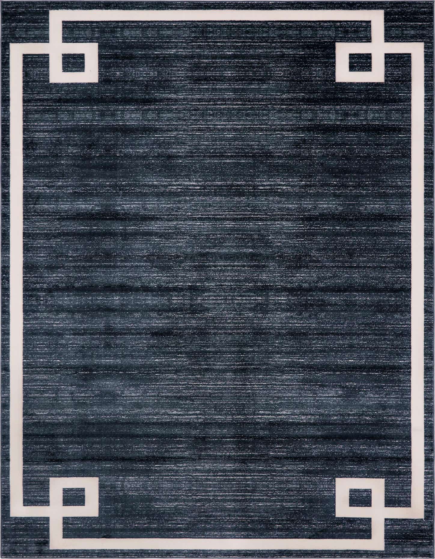 A 9x12 rectangular navy blue rug with a textured, solid field and a modern white Greek key border pattern.