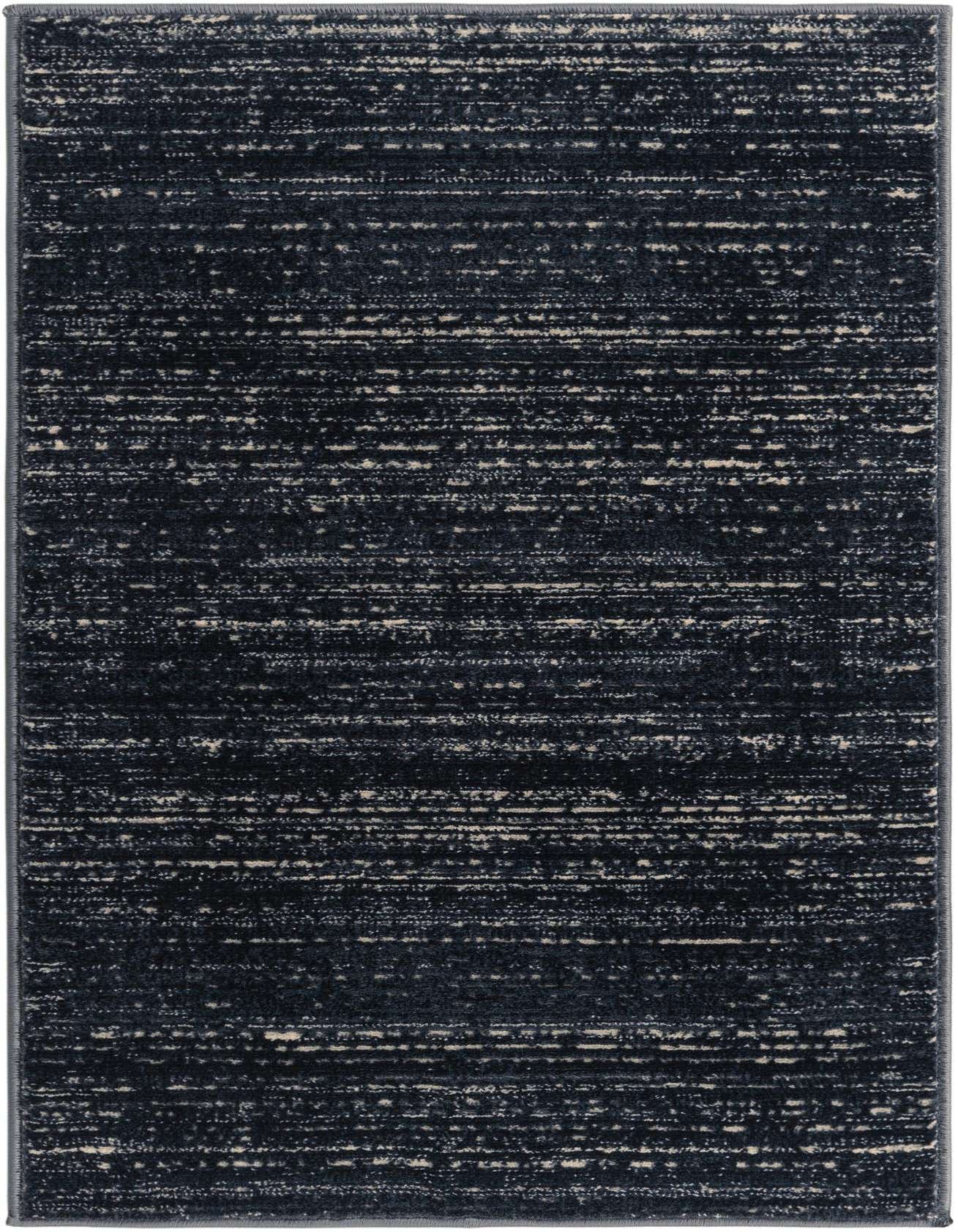 A 2x3 rectangular navy blue rug with a modern, textured, distressed pattern featuring lighter blue and cream accents.
